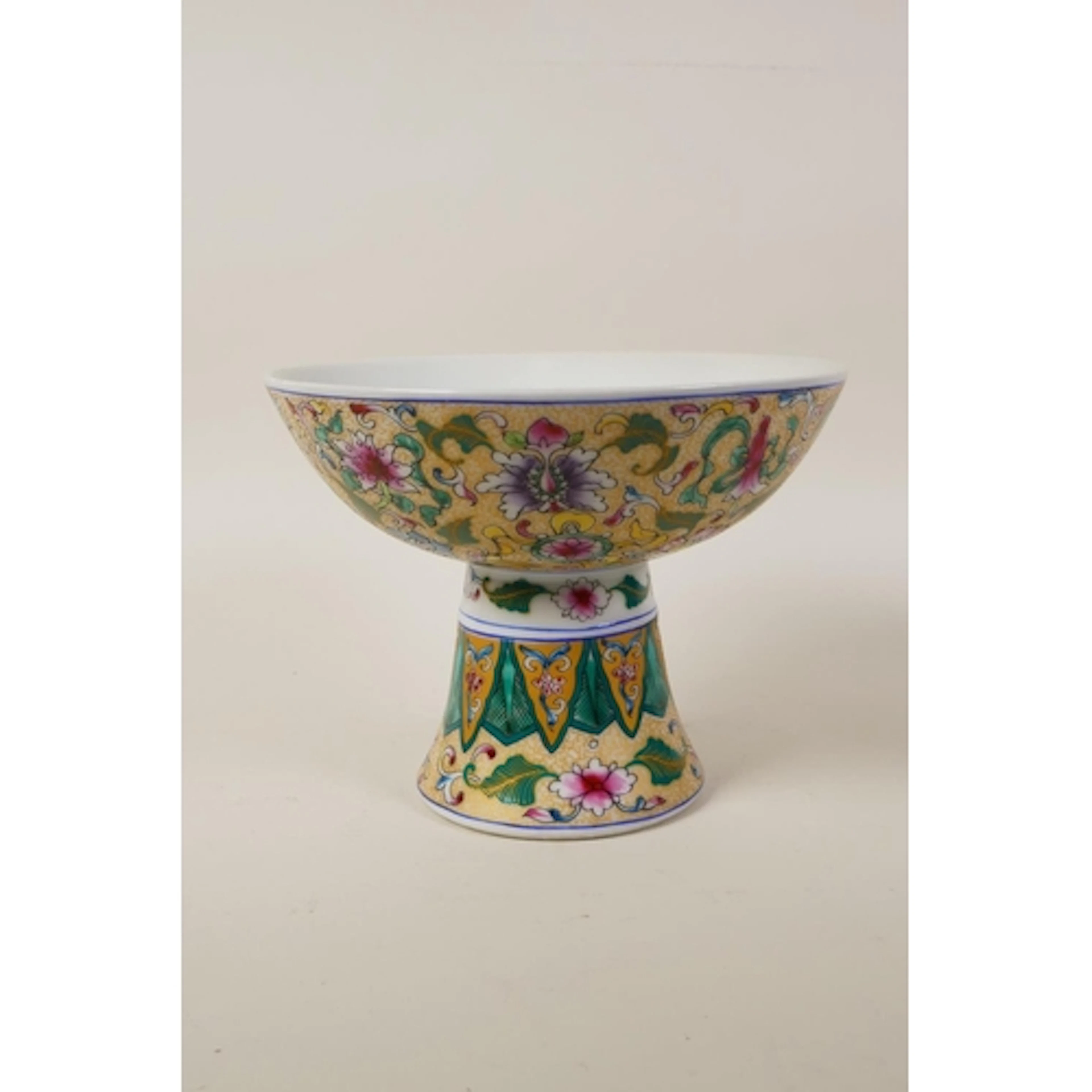 A Chinese famille verte porcelain stem bowl decorated with b...