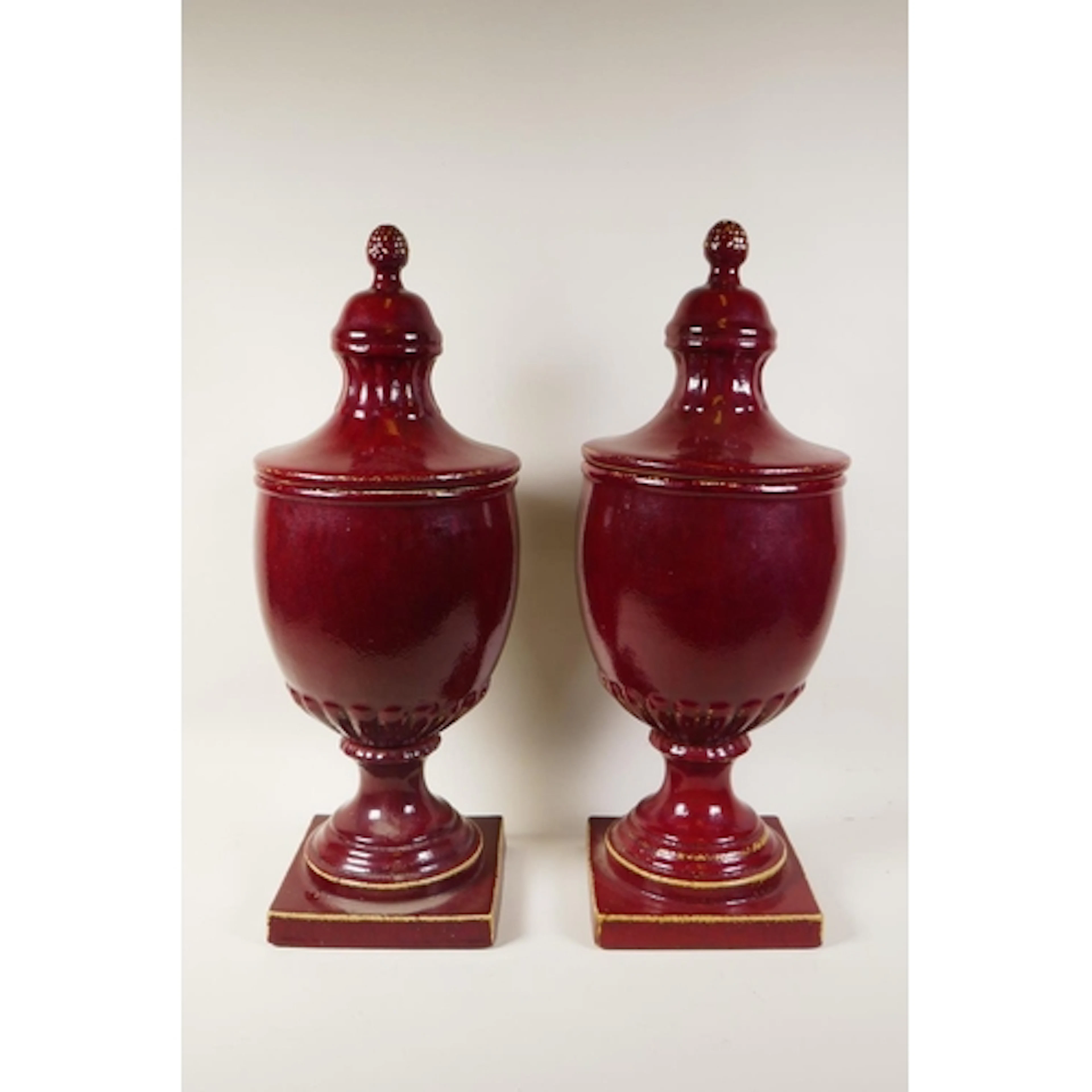 A pair of flambe glazed ceramic urns and covers, 53cm high