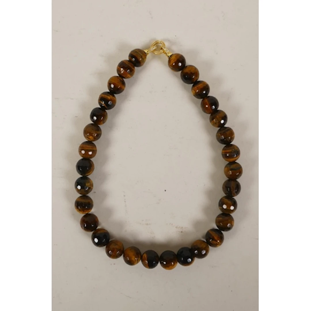 A faceted tiger's eye beaded necklace with cubic zirconia se...