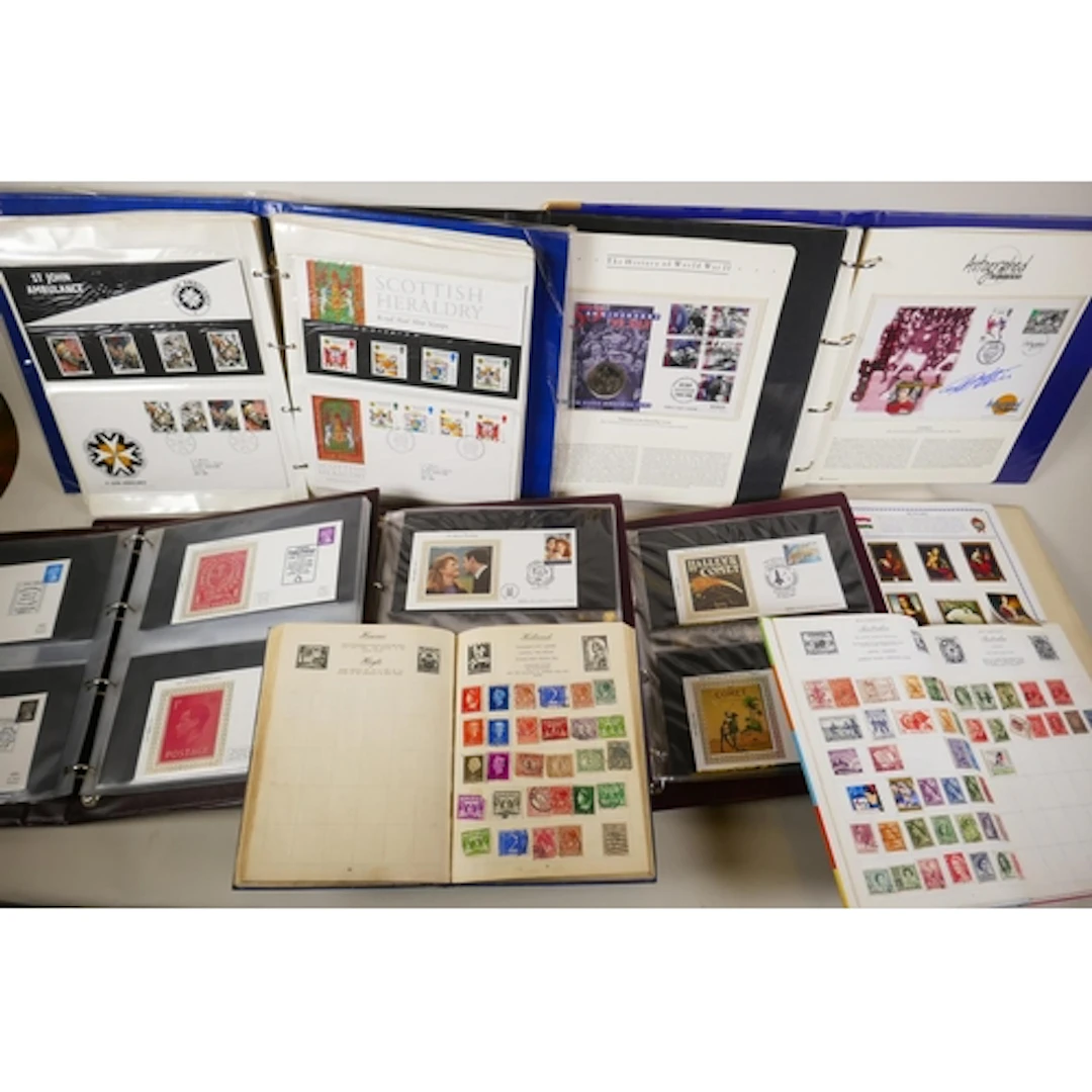 Quantity of world stamps and first day covers in collectors'...
