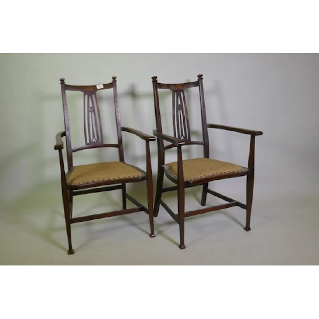 Pair of Arts & Crafts mahogany elbow chairs with pierced...