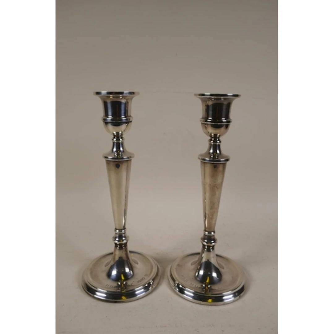 A pair of silver candlesticks by W.I. Broadway & Co, Bir...