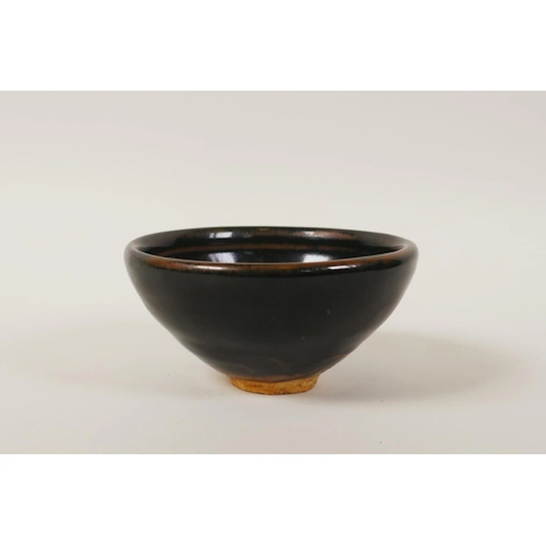 A Chinese cizhou kiln rice bowl with leaf skeleton design, 1...