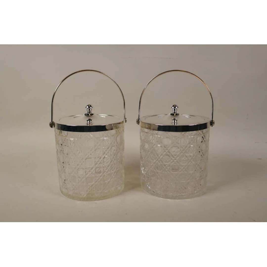 A pair of silver plated and cut glass biscuit barrels, 13cm ...