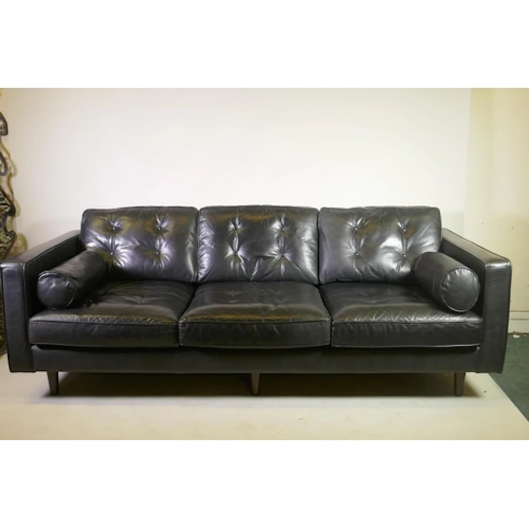 A contemporary black leather settee, 224cm long, 97cm deep