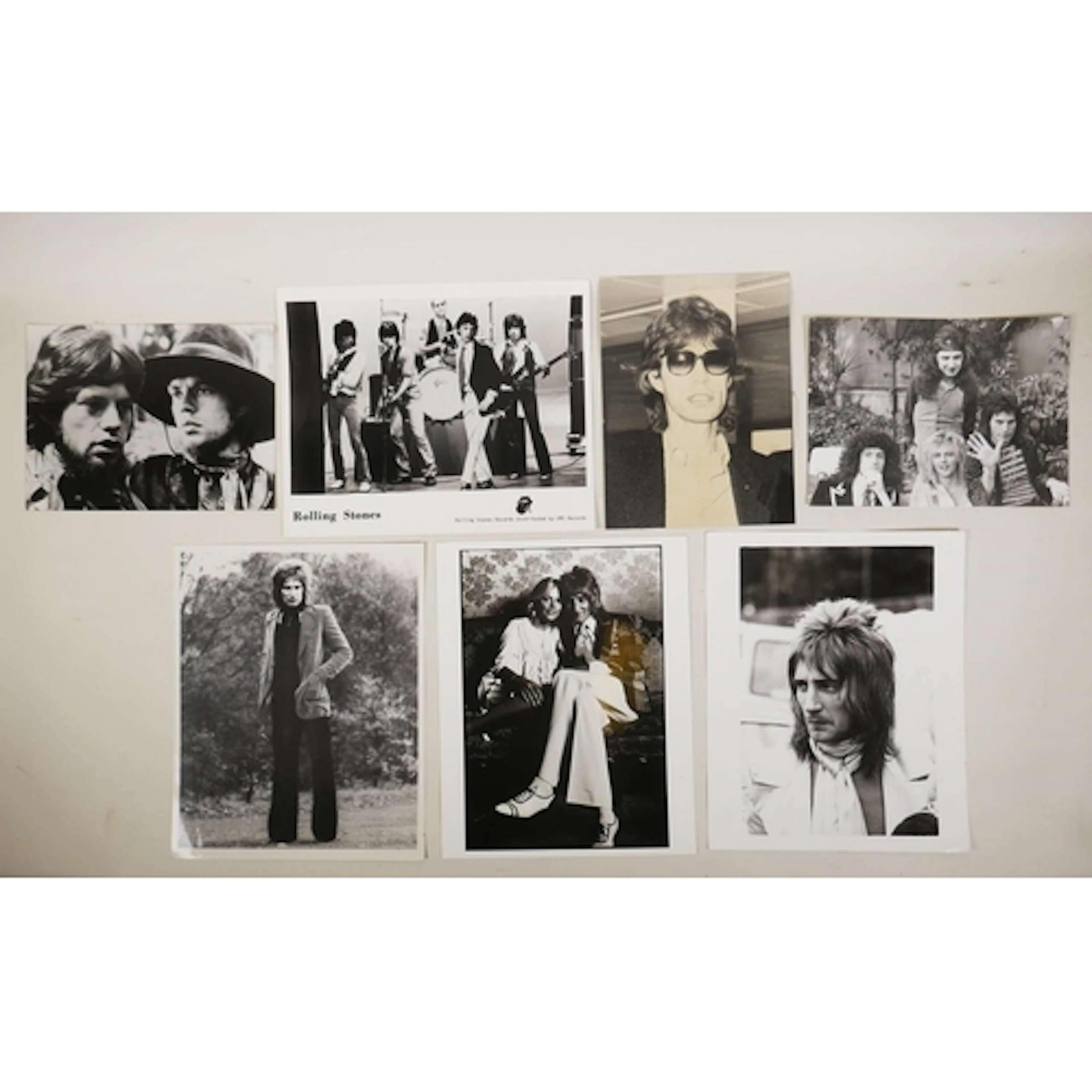 A collection of black and white press photos of iconic music...