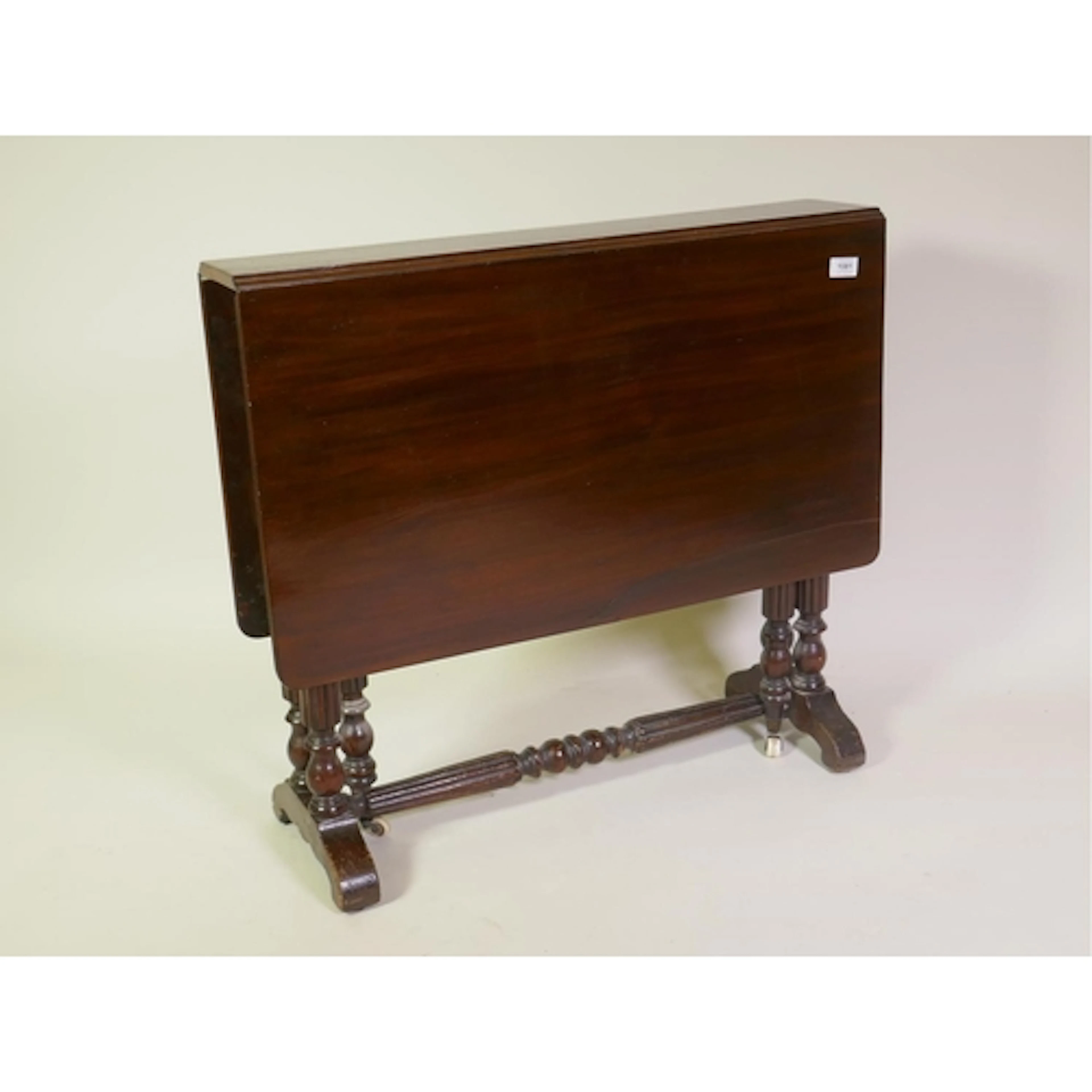 A C19th mahogany Sutherland table, raised on reeded end supp...