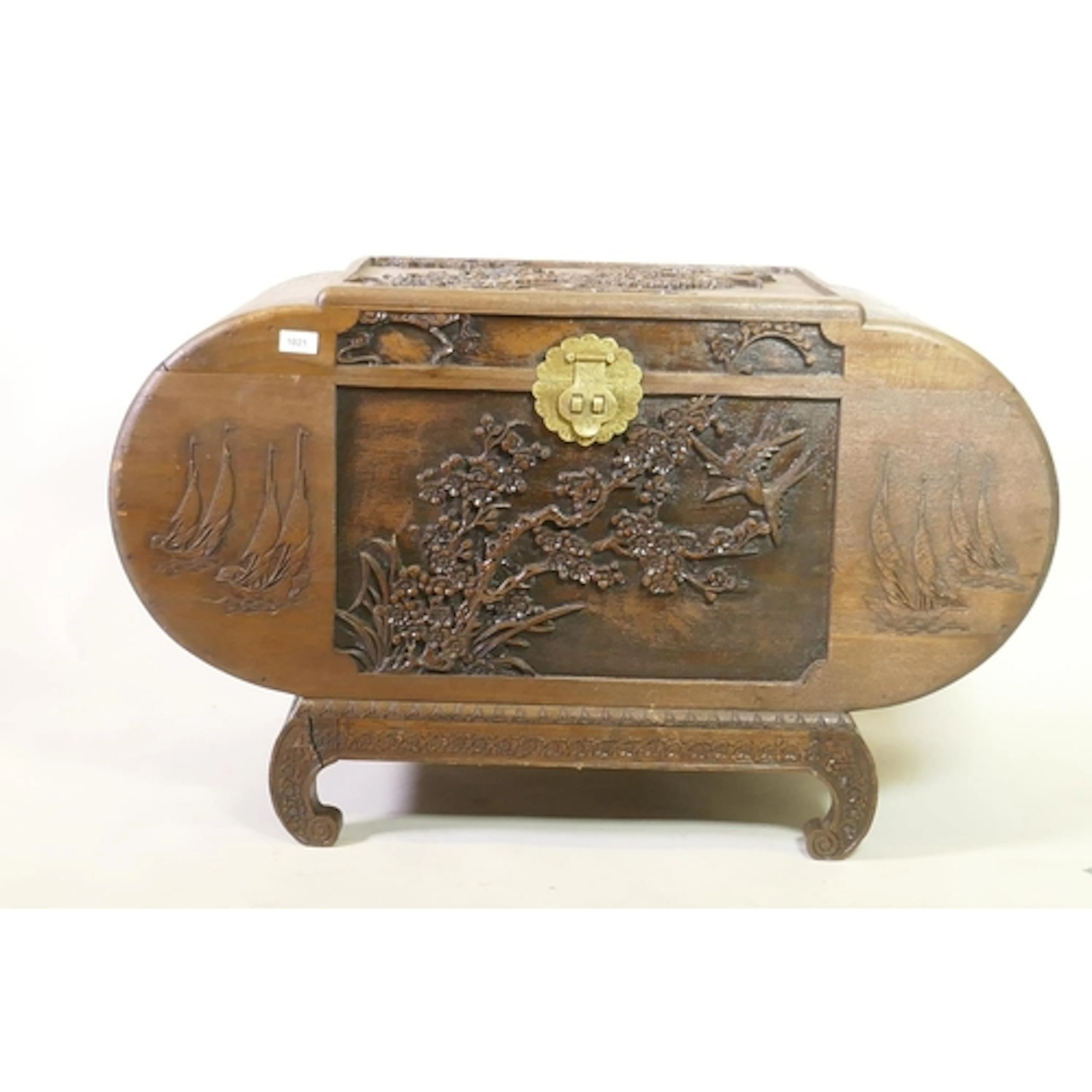 A Chinese carved camphorwood chest with brass lock, 102 x 51...