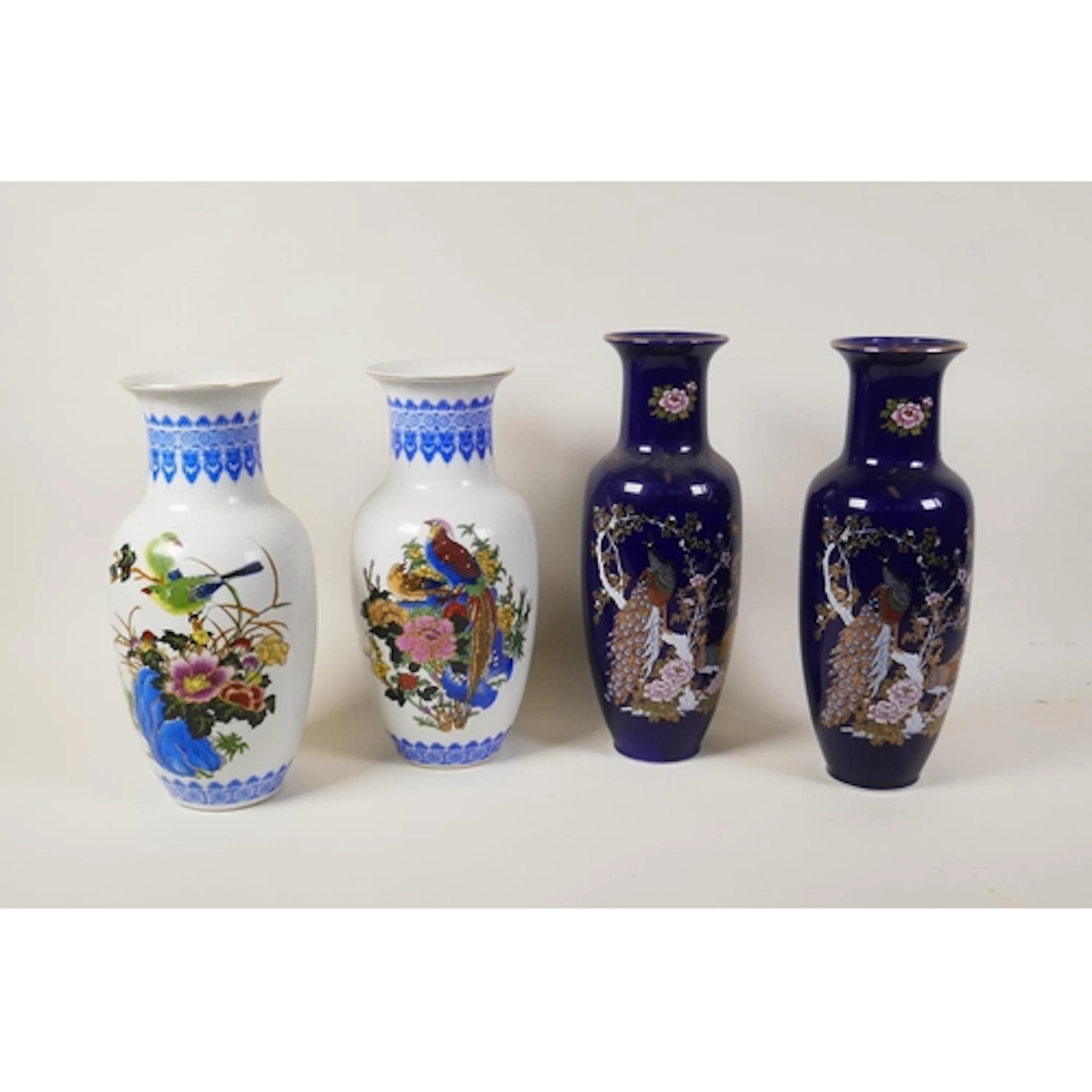 Two pairs of oriental ceramic vases decorated with asiatic b...