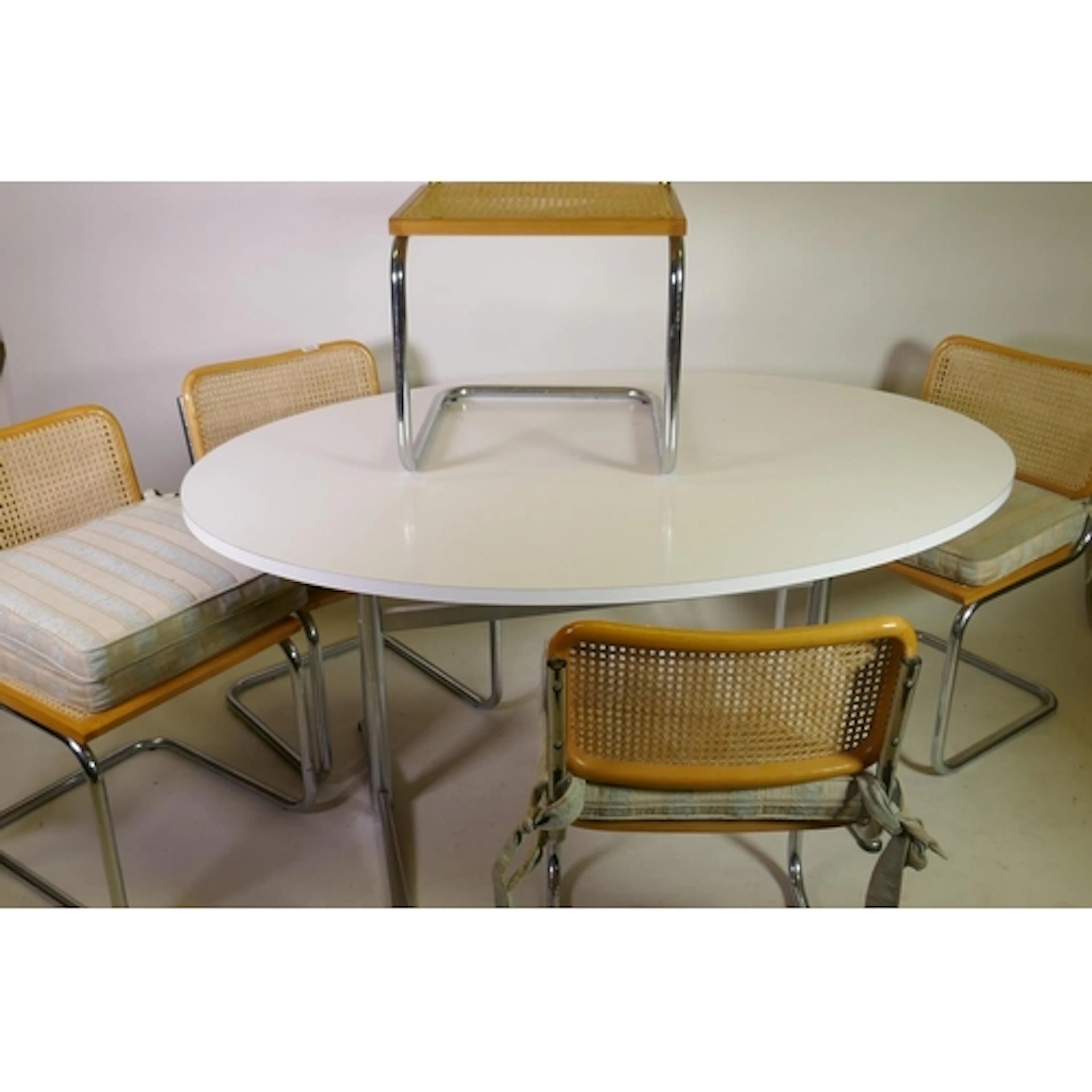 Mid century formica top dining table, raised on chromed meta...