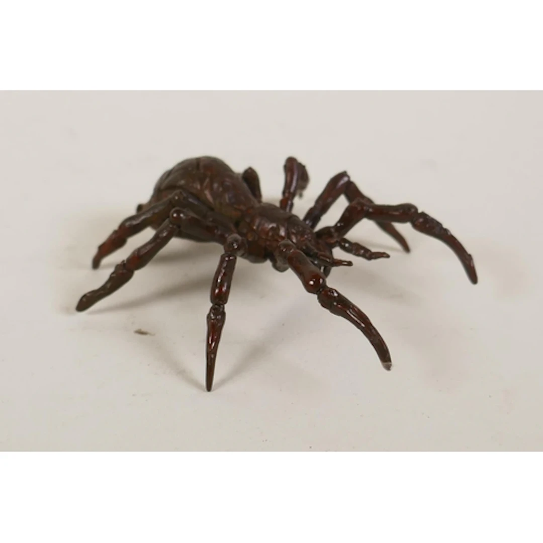 An oriental bronzed metal spider, impressed character mark t...