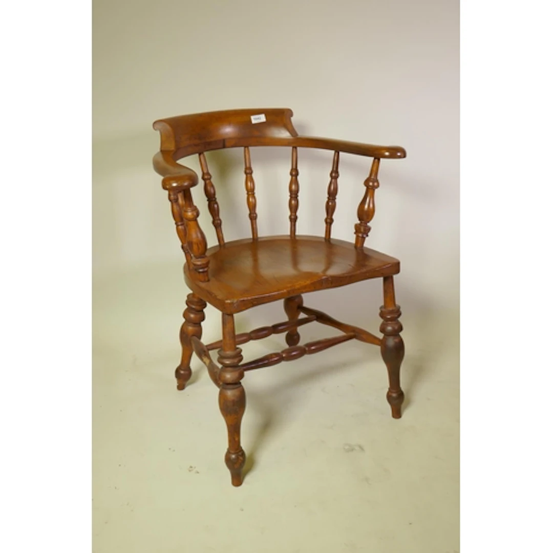 Antique smoker's bow armchair with shaped elm seat and spind...