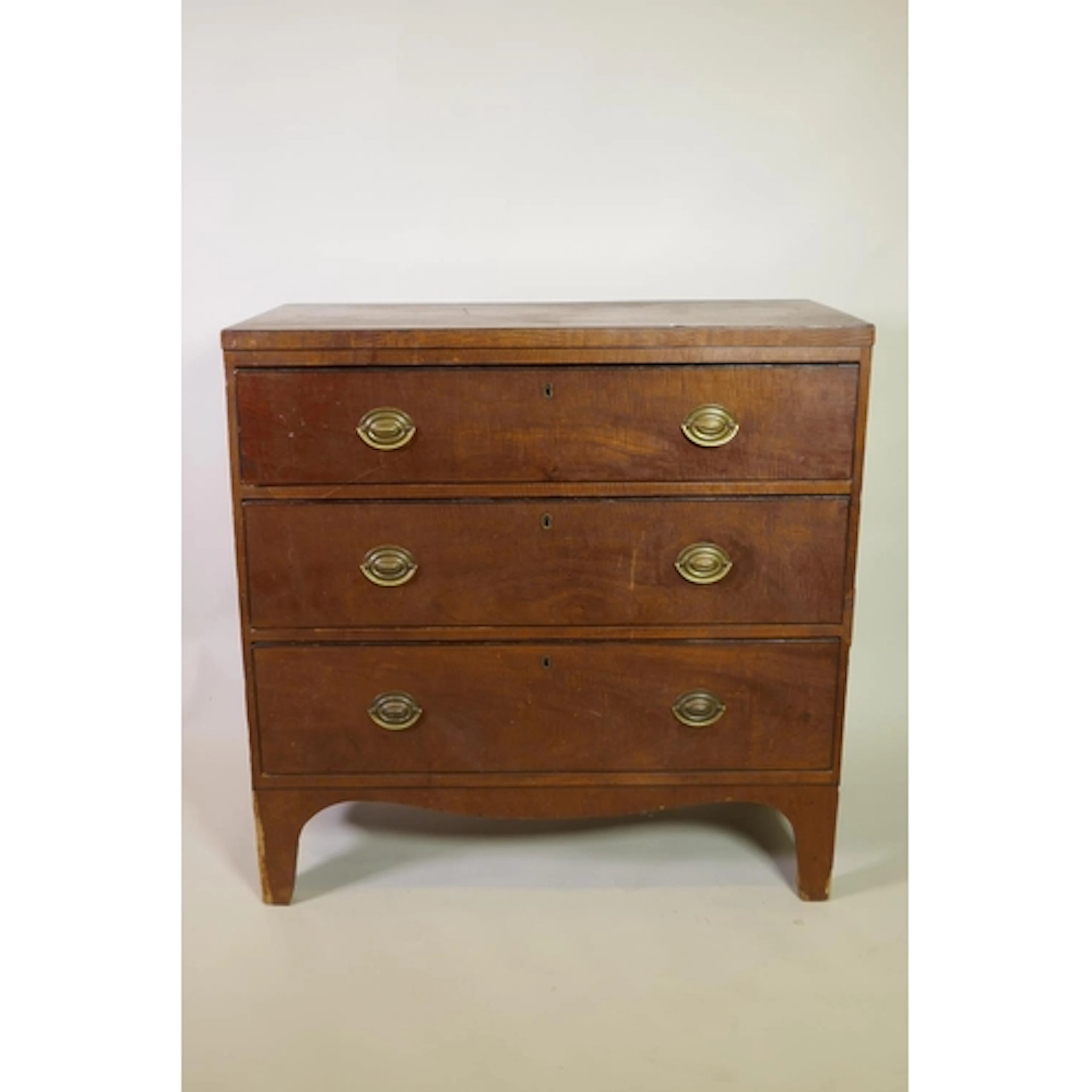 An early C19th fiddle-back mahogany veneered chest of three ...