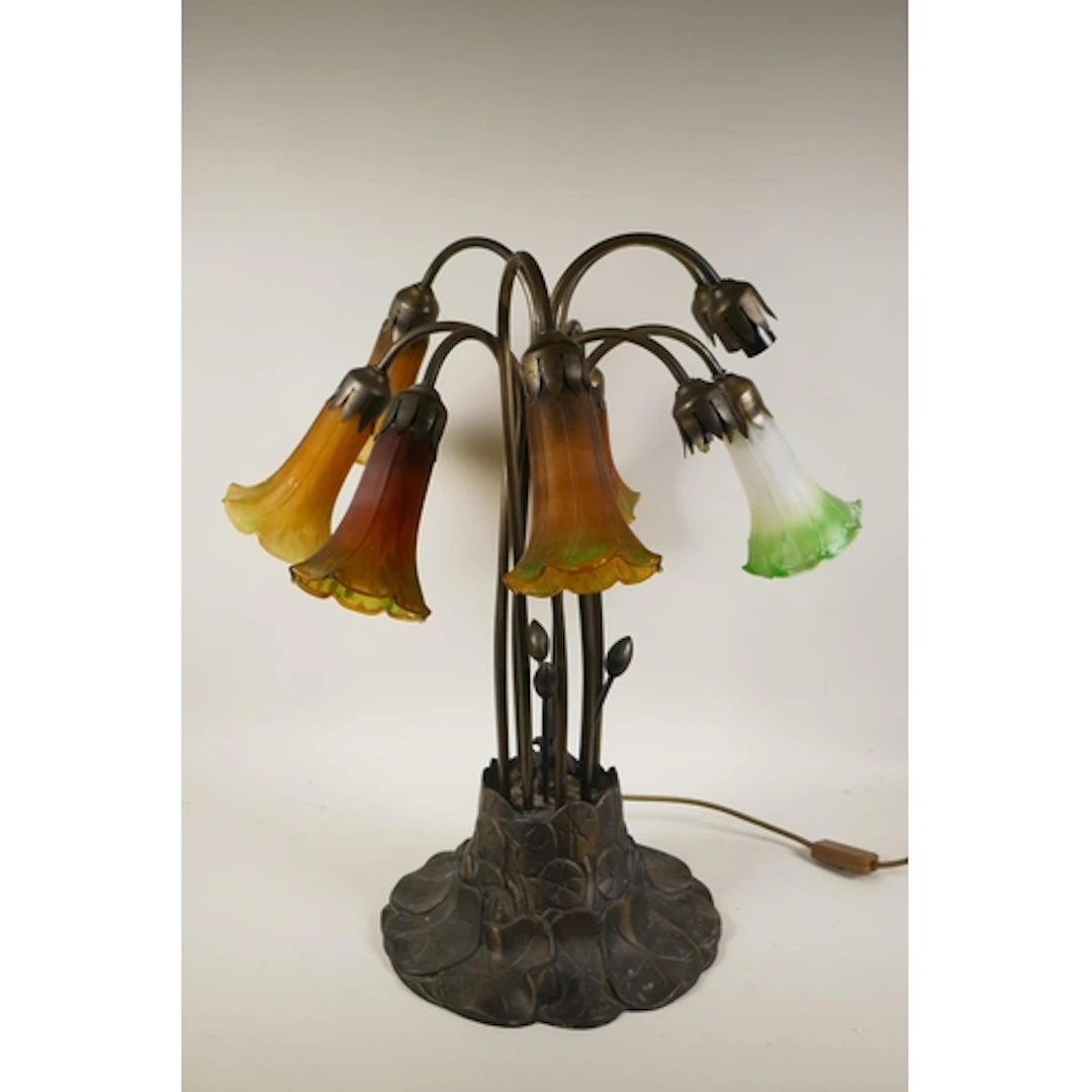 An Art Nouveau style multi stem lily table lamp, in the mann...