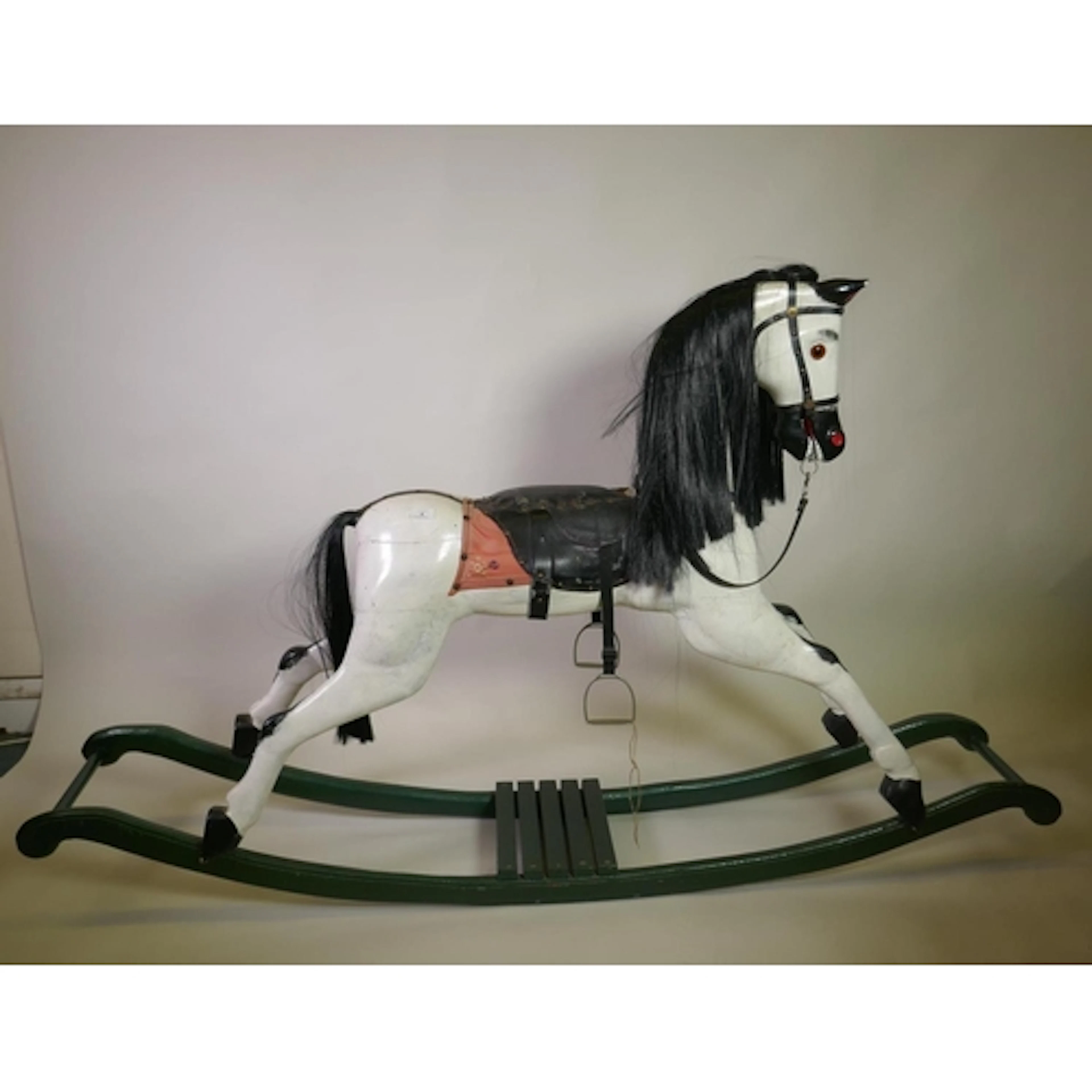 A late C19th/early C20th painted pine rocking horse, 183cm l...