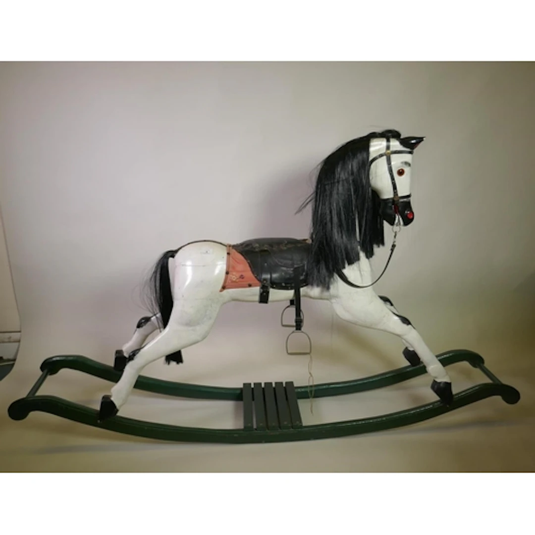A late C19th/early C20th painted pine rocking horse, 183cm l...