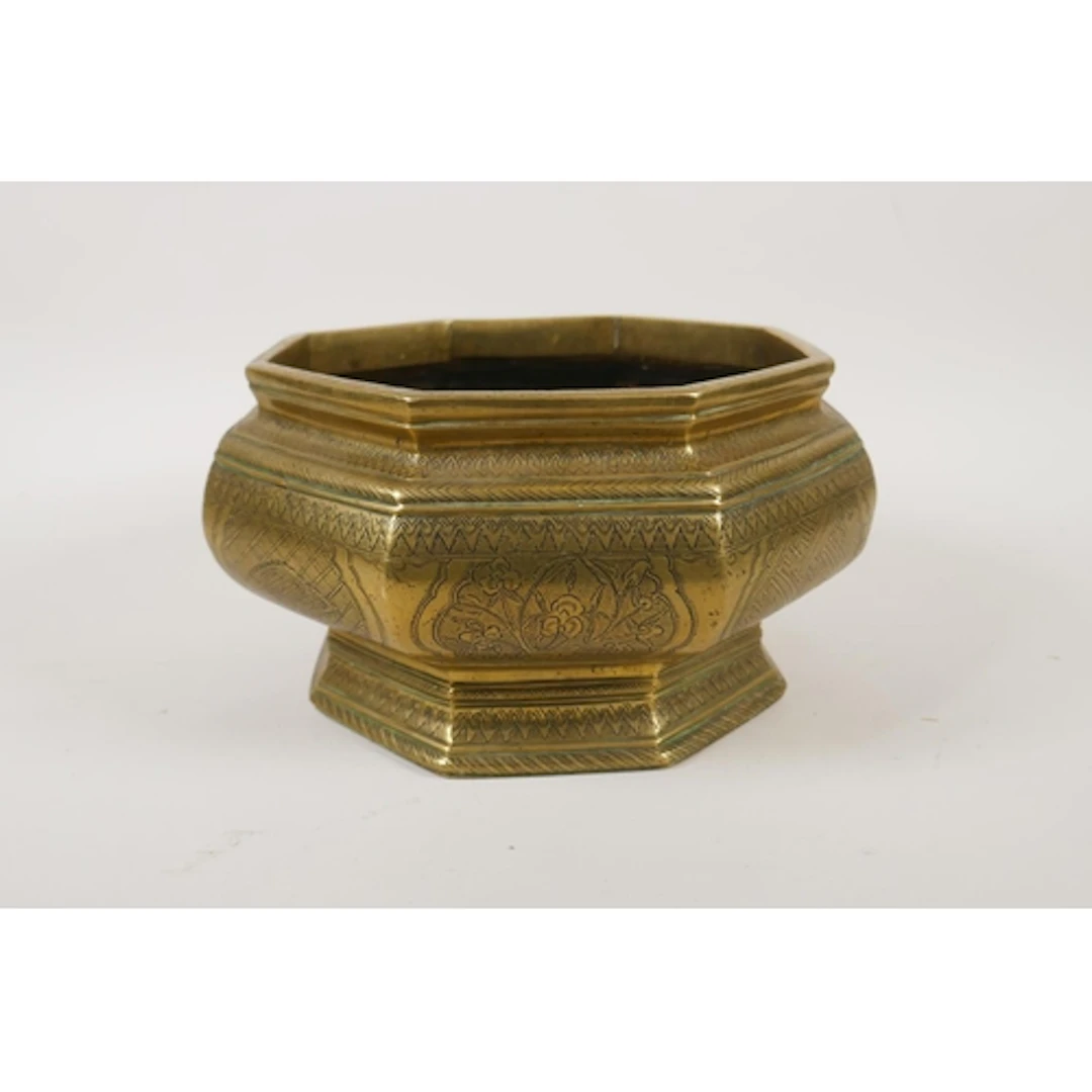 An antique south east Asian octagonal brass betel nut dish/c...
