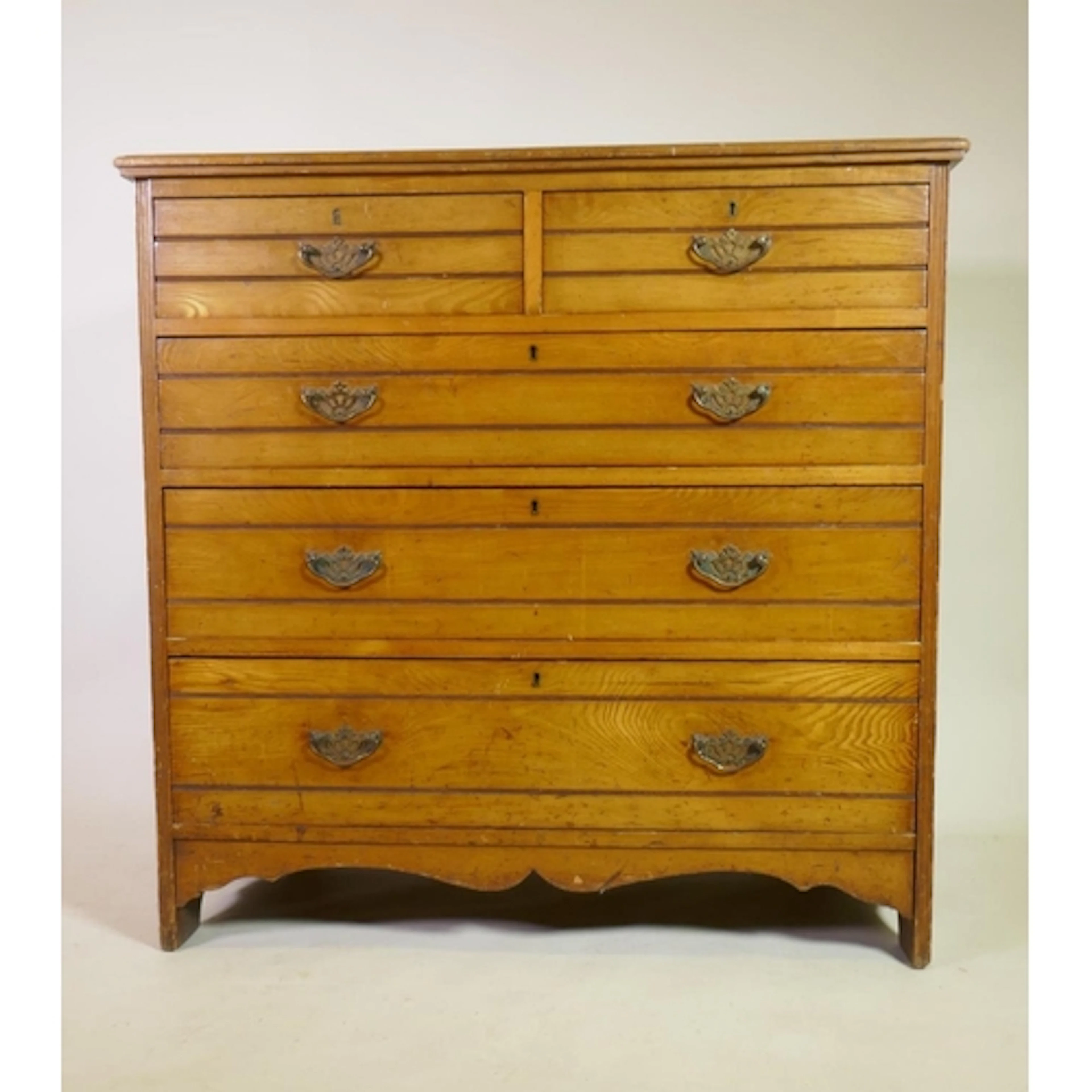 A Victorian golden ash chest of two over three drawers with ...