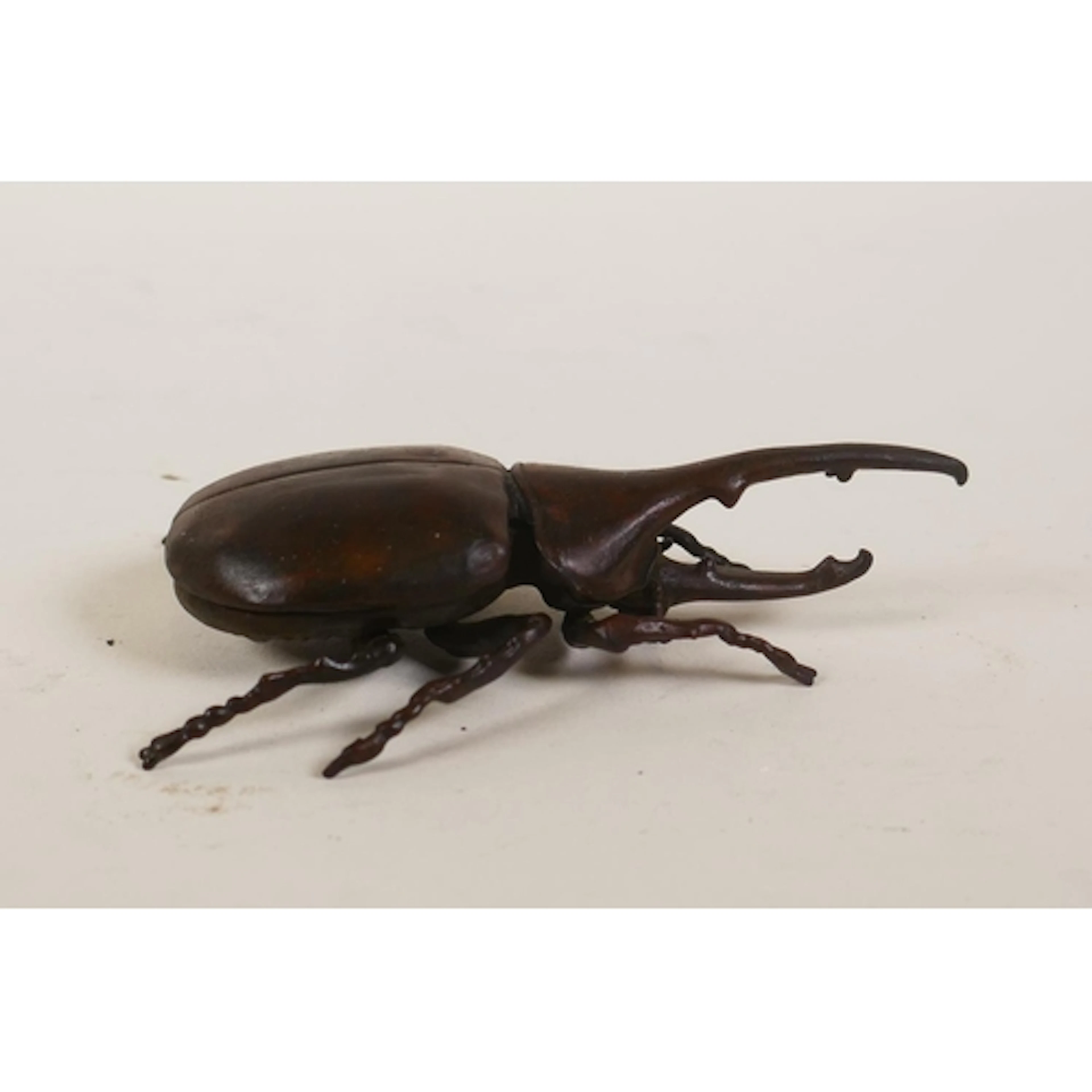 A Japanese jizai style bronzed metal Hercules beetle with ar...