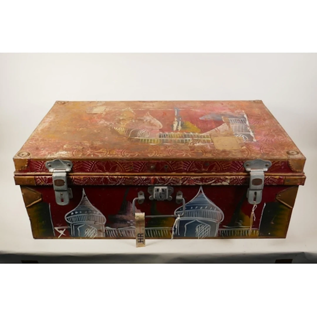 A painted metal travel trunk with Indian folk art style deco...