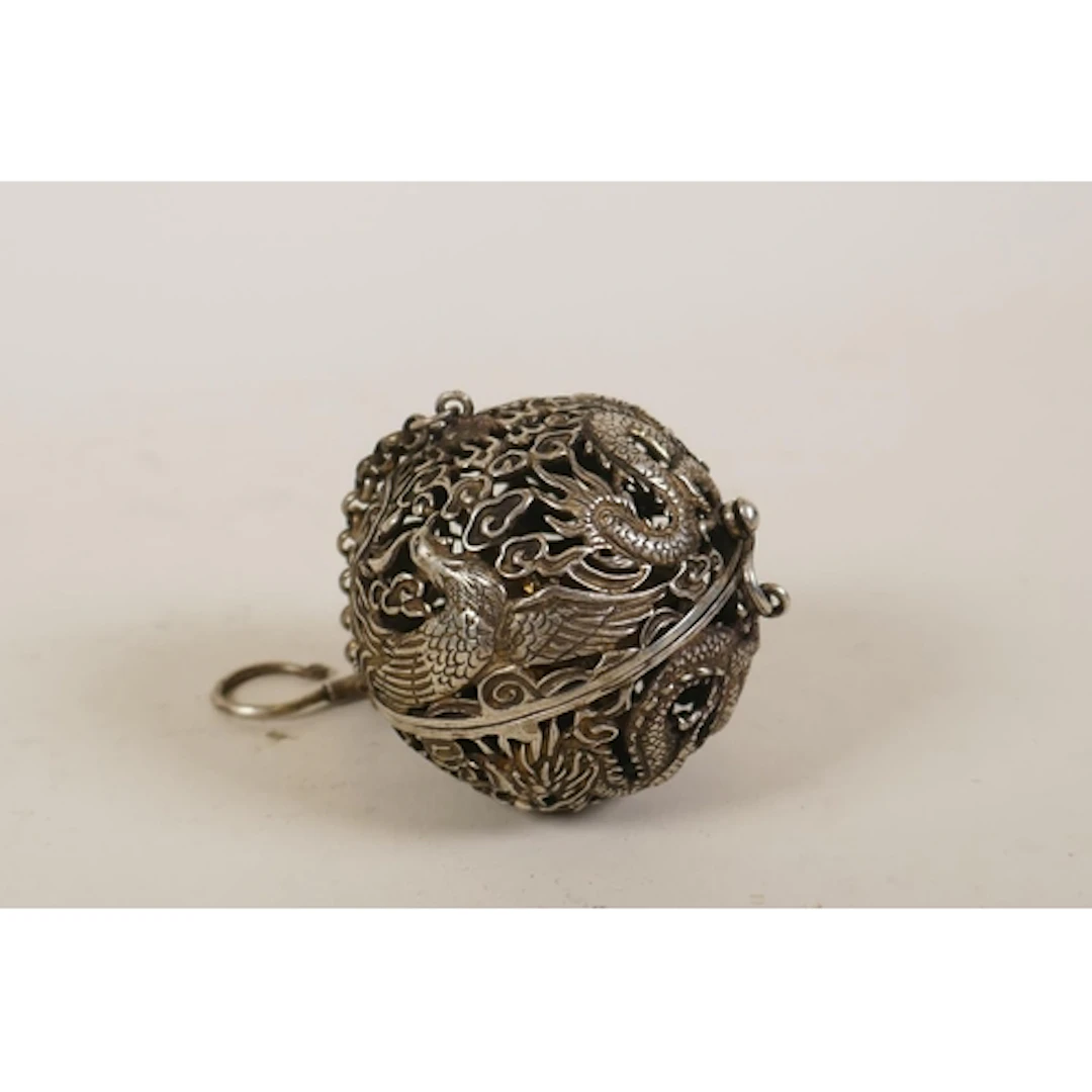 A Chinese pierced white metal bull censer with gimbal ...