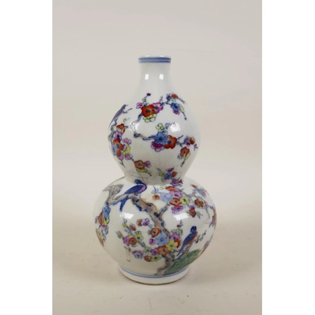 A Chinese doucai porcelain double gourd vase decorated with ...