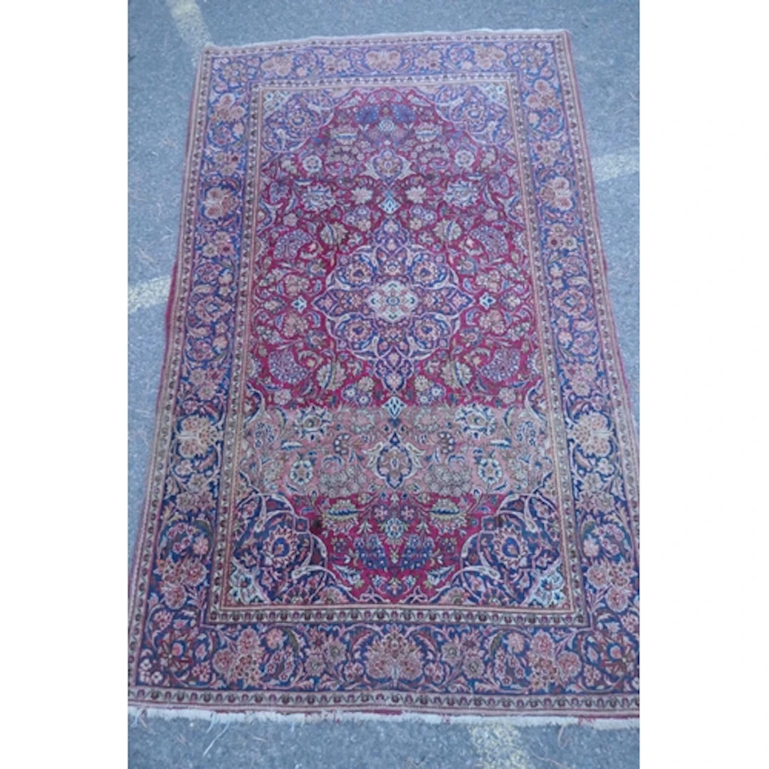 A Persian Kashan hand woven wool carpet with traditional des...