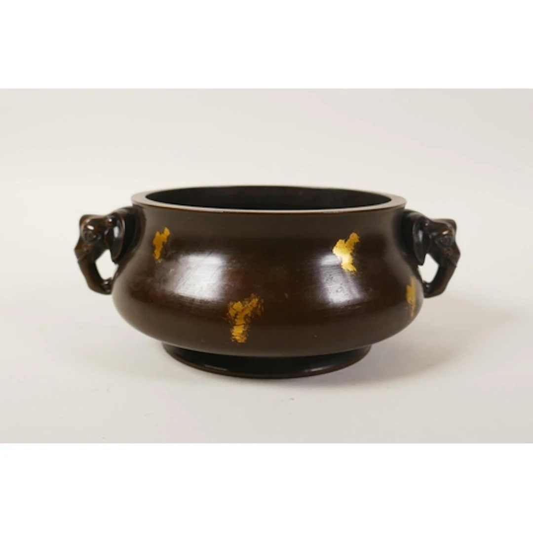 A Chinese gilt splashed bronze censer with two elephant head...