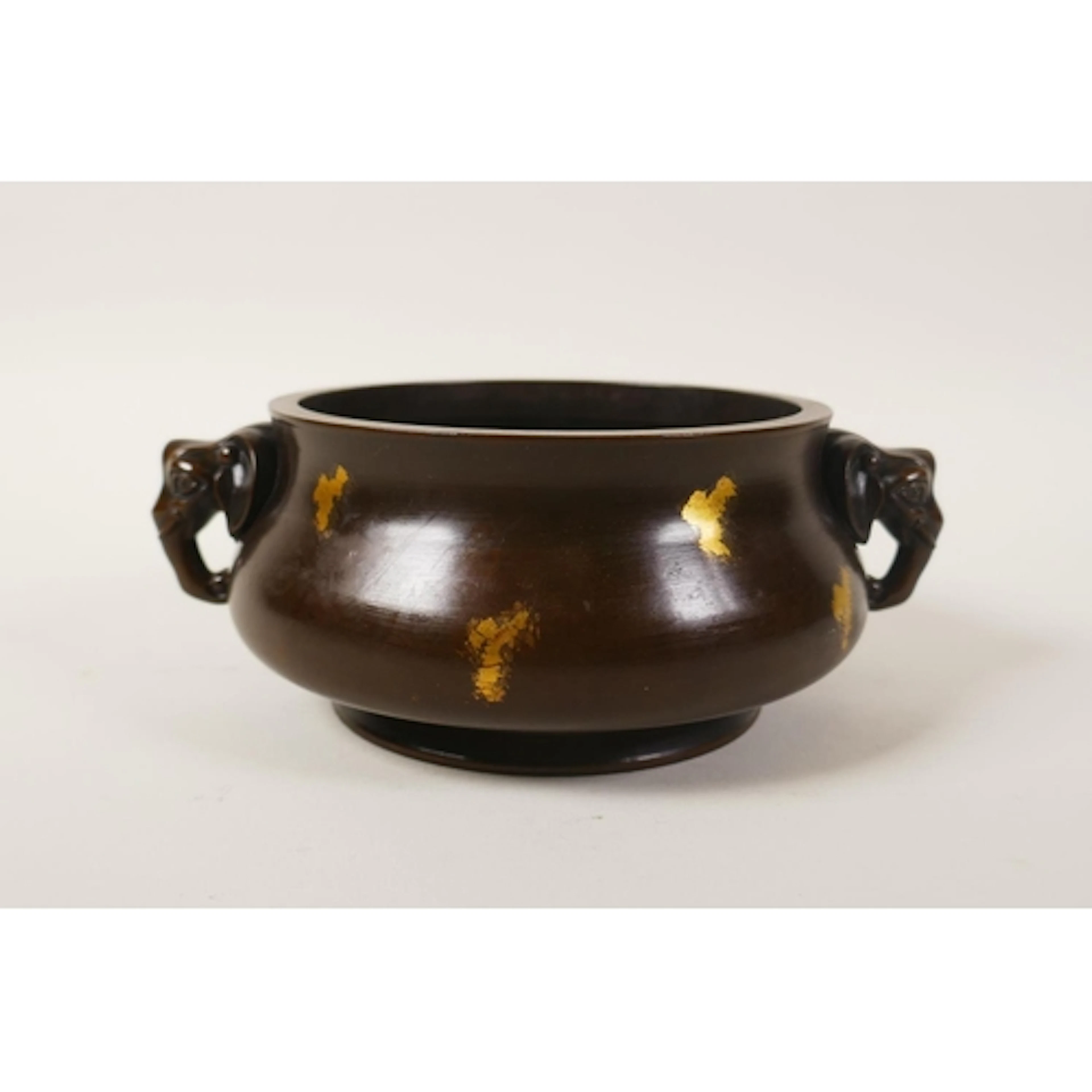 A Chinese gilt splashed bronze censer with two elephant head...