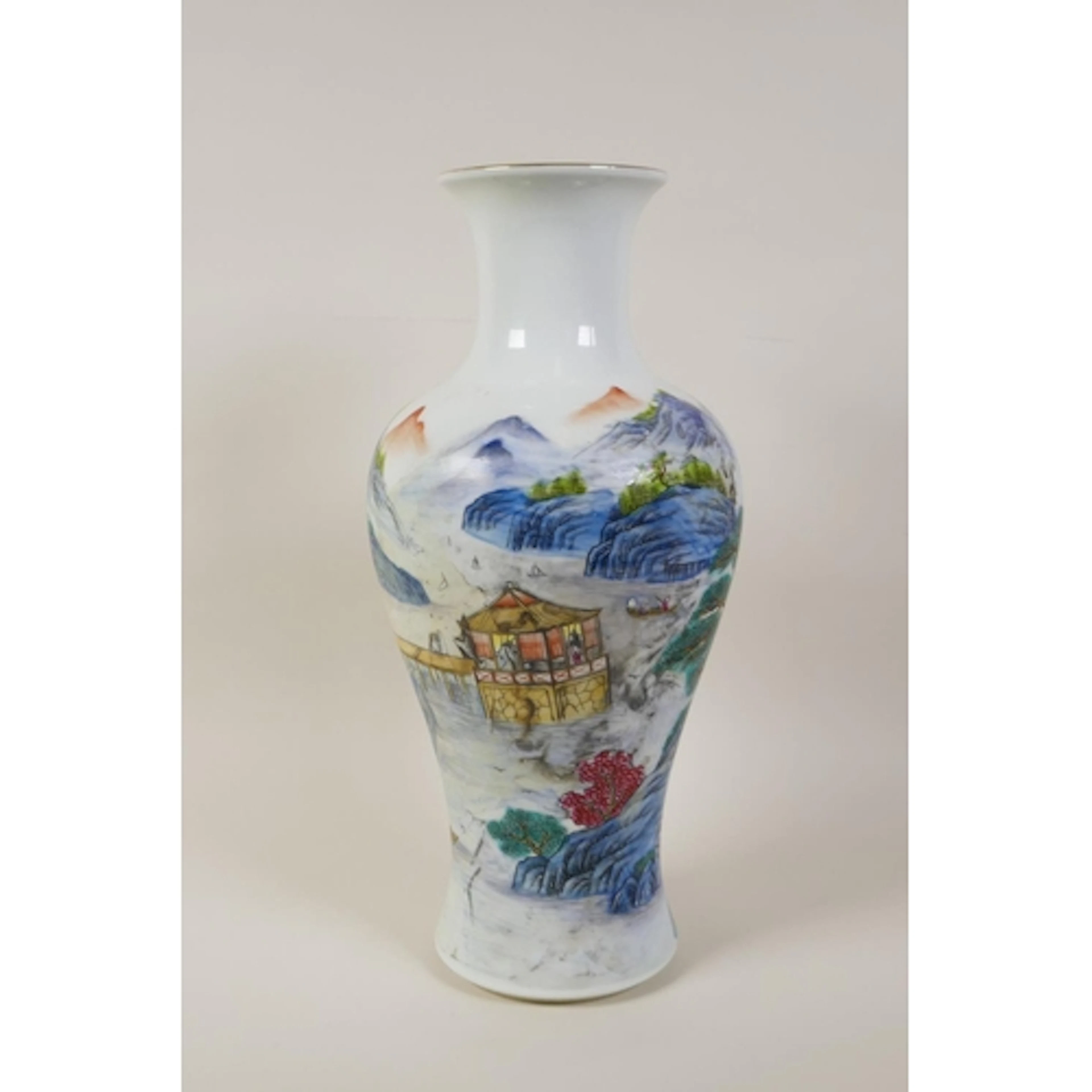 A Chinese polychrome porcelain vase decorated with a rocky r...
