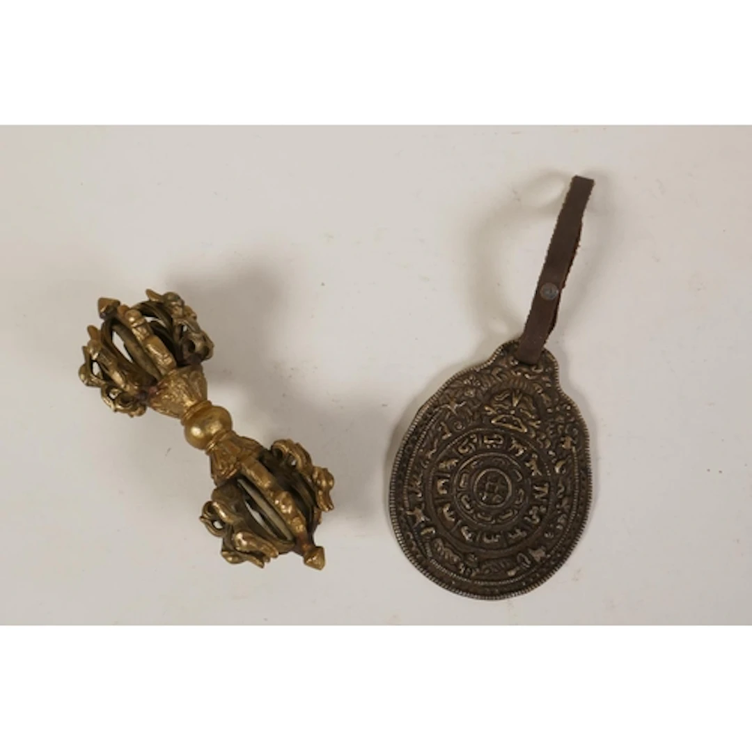 A Tibetan bronze ceremonial vajra and a Tibetan white metal ...