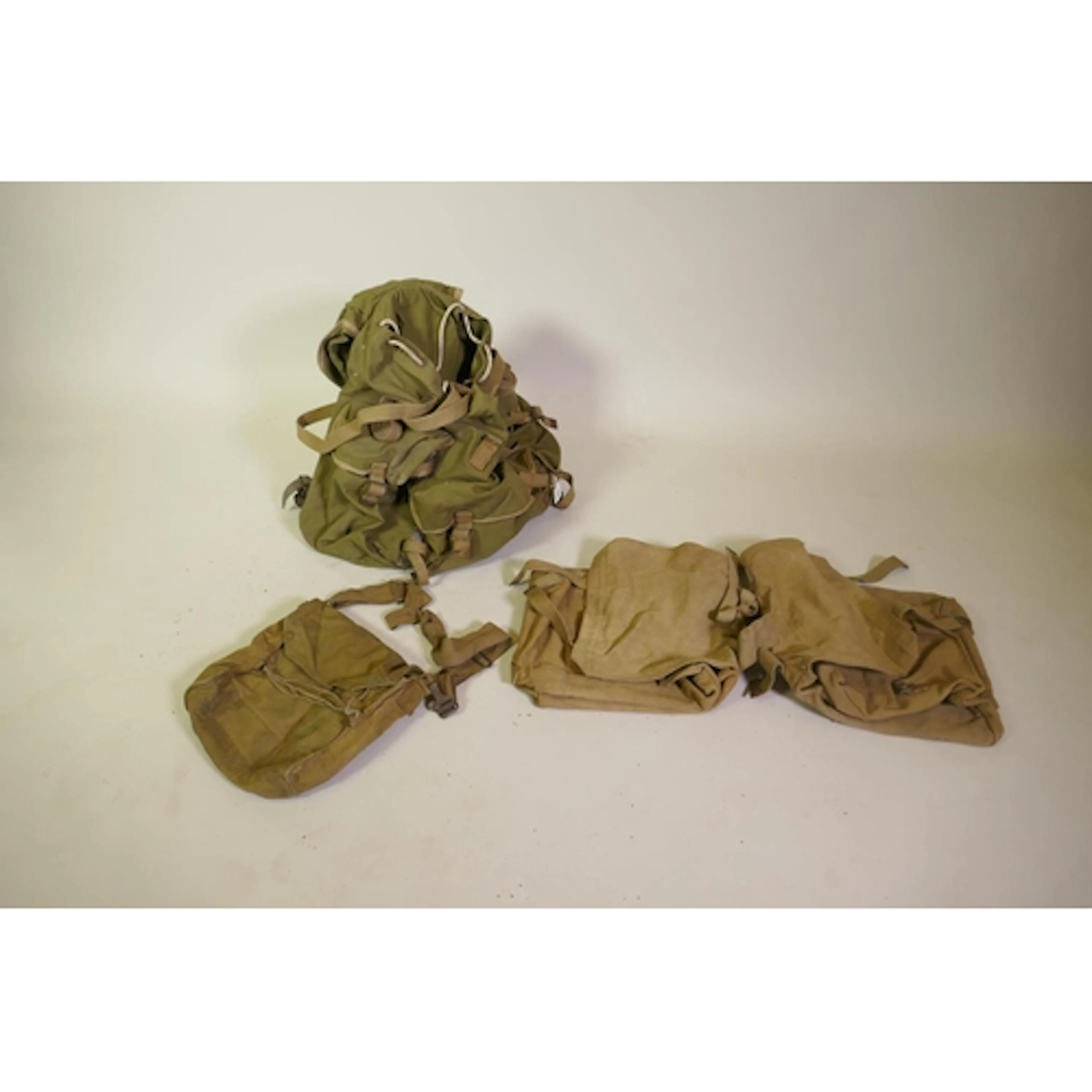 A vintage canvas rucksack with metal frame, canvas saddle ba...