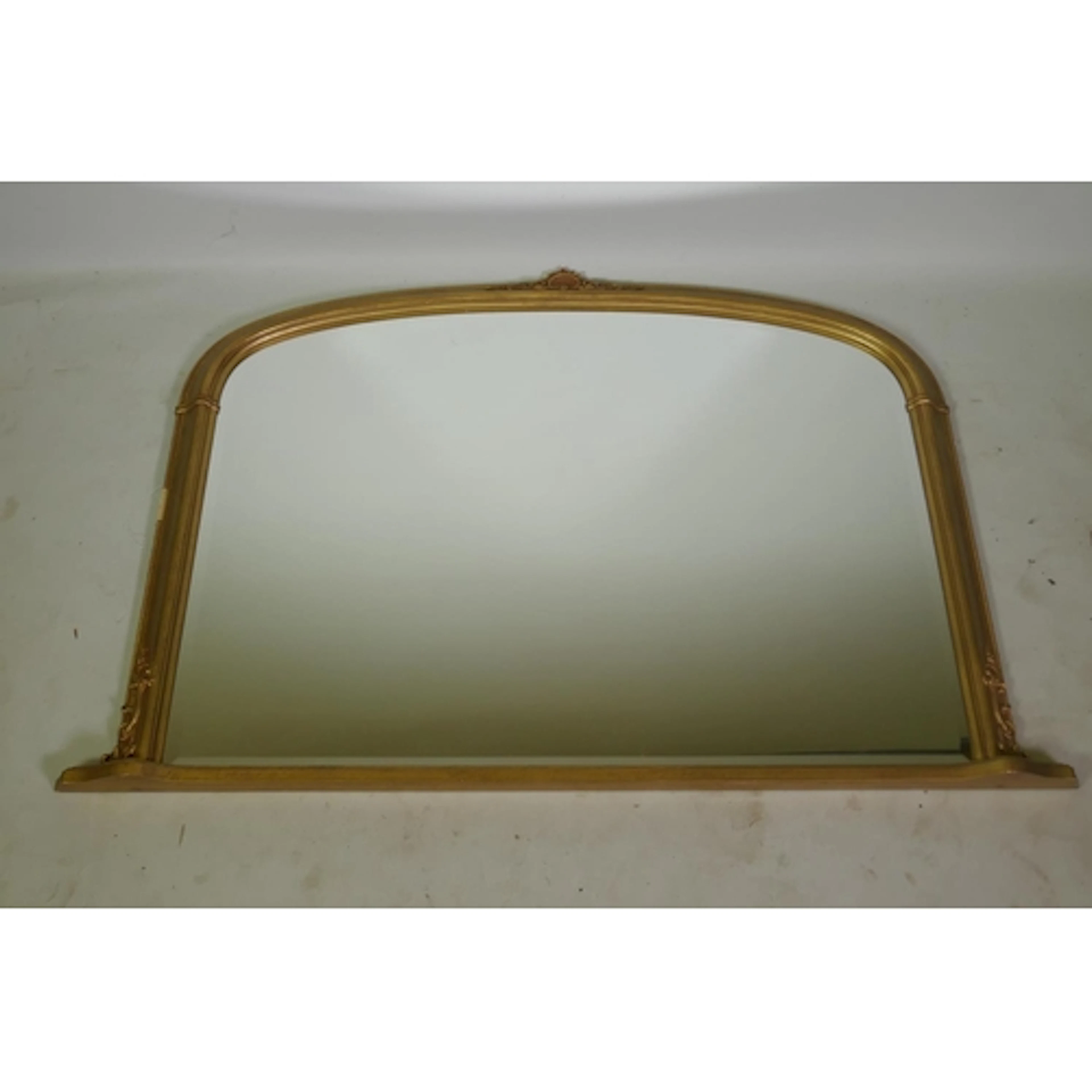 A gilt bevelled glass overmantel mirror, 118 x 80cm