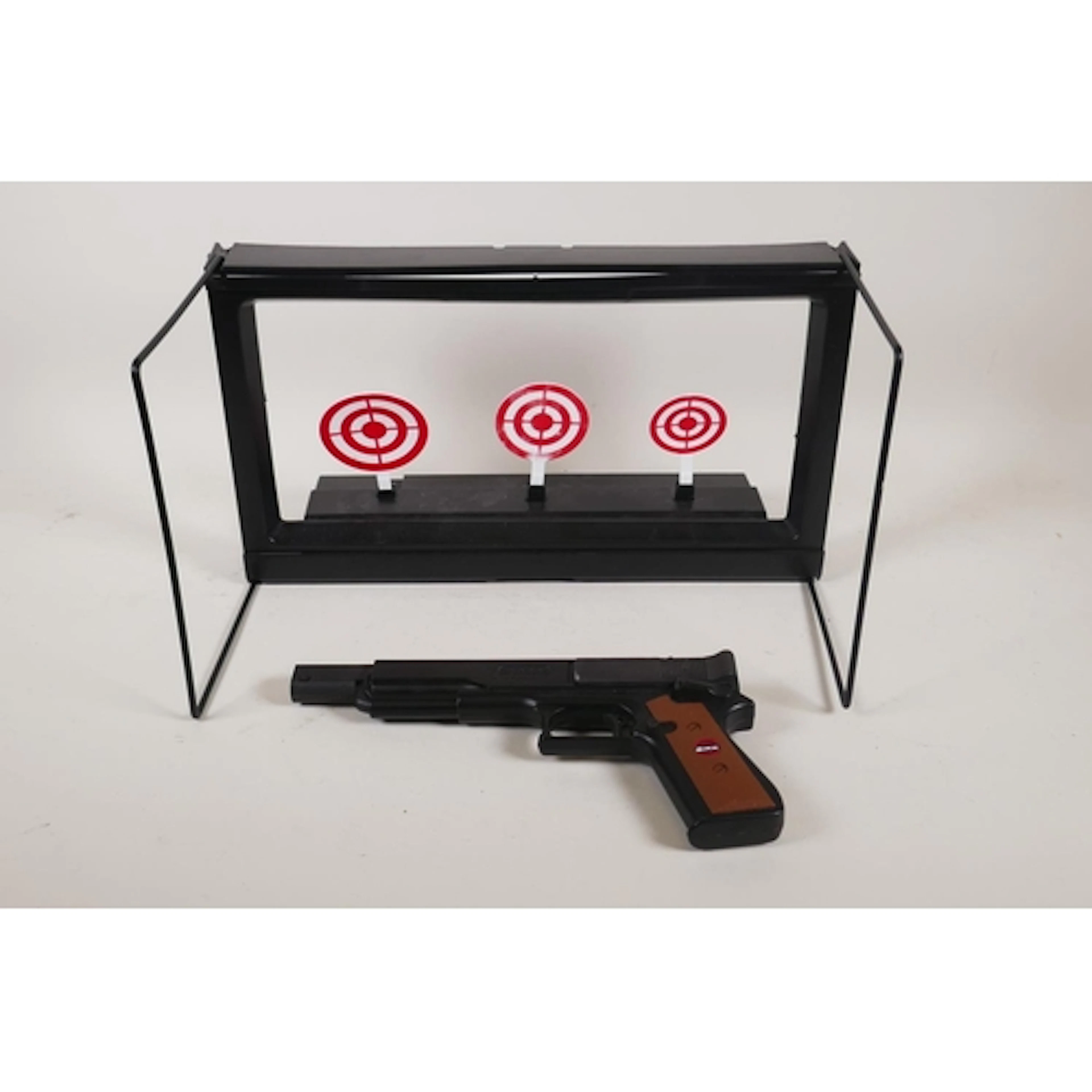 An SMK G-2005 Repeater .177 cal air pistol and a practice ta...