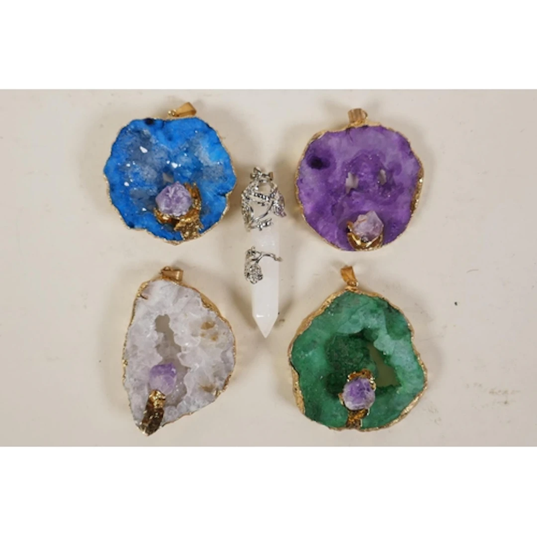 Four gilt metal mounted coloured crystal pendants, and a whi...