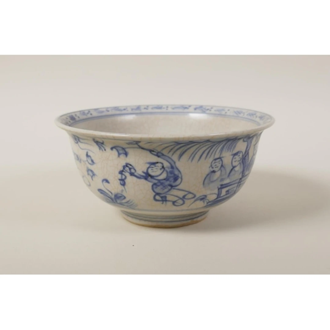 A Chinese blue and white porcelain rice bowl decorated with ...