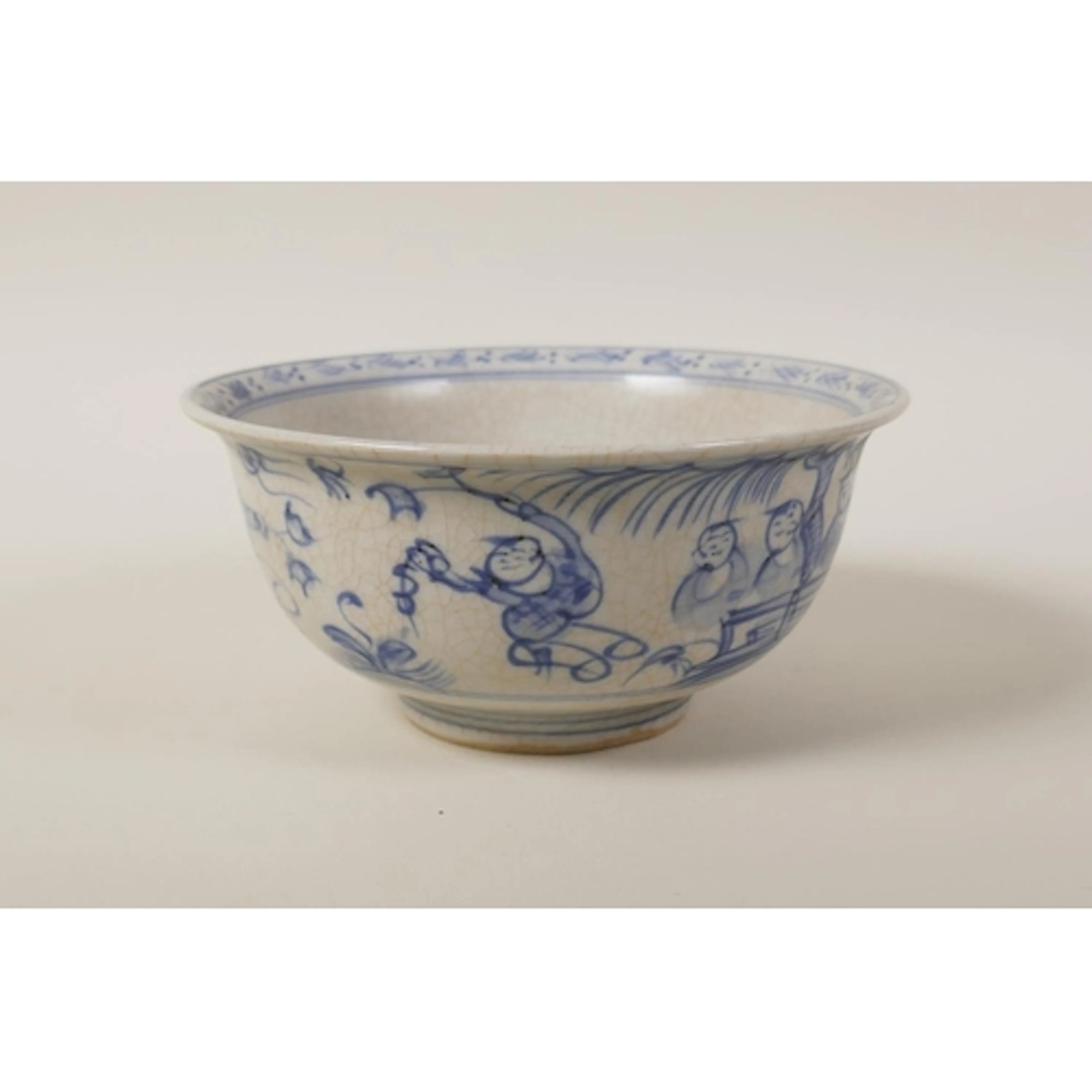 A Chinese blue and white porcelain rice bowl decorated with ...