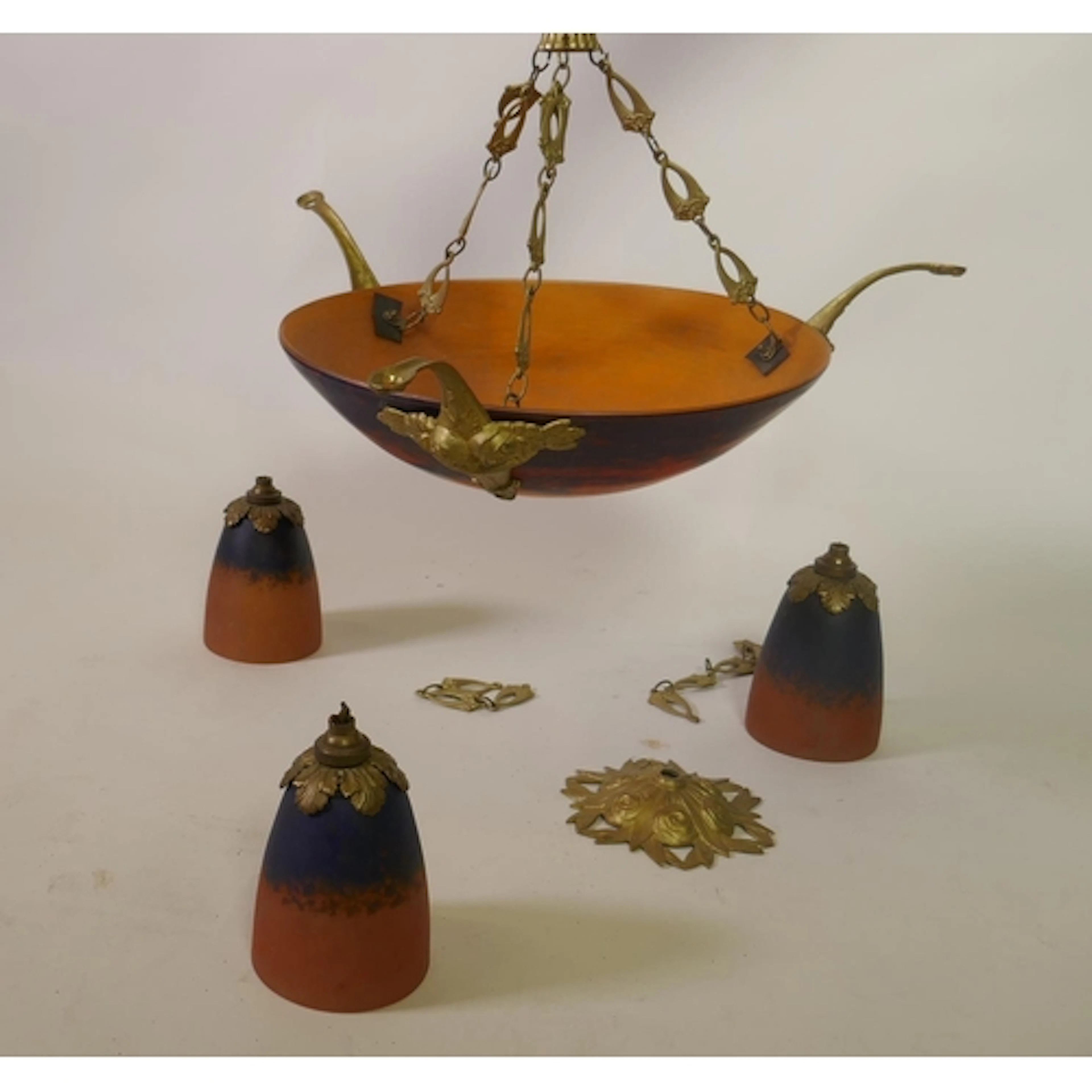 A cameo glass shade hanging ceiling lamp with three branches...