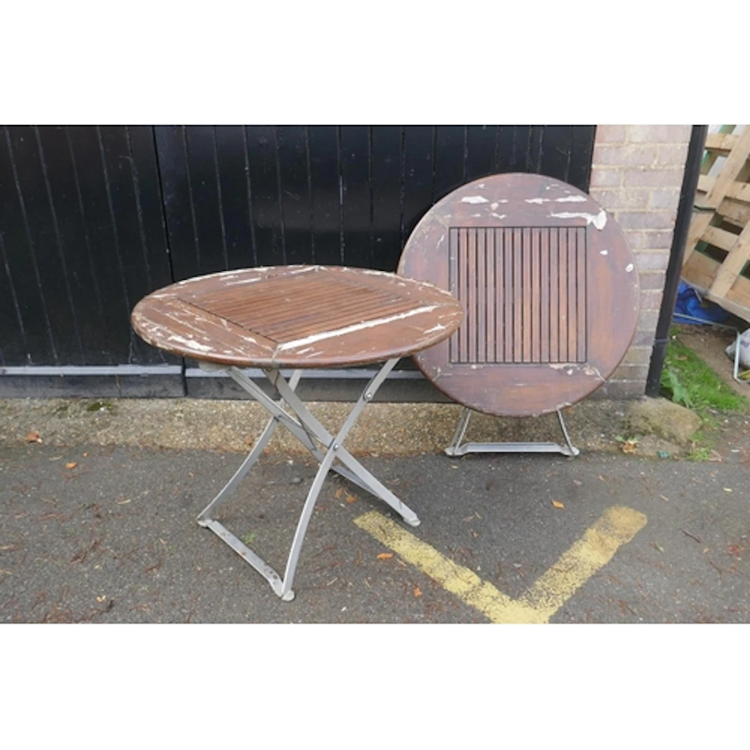 A pair of 'Lister' garden tables with slatted teak tops and ...