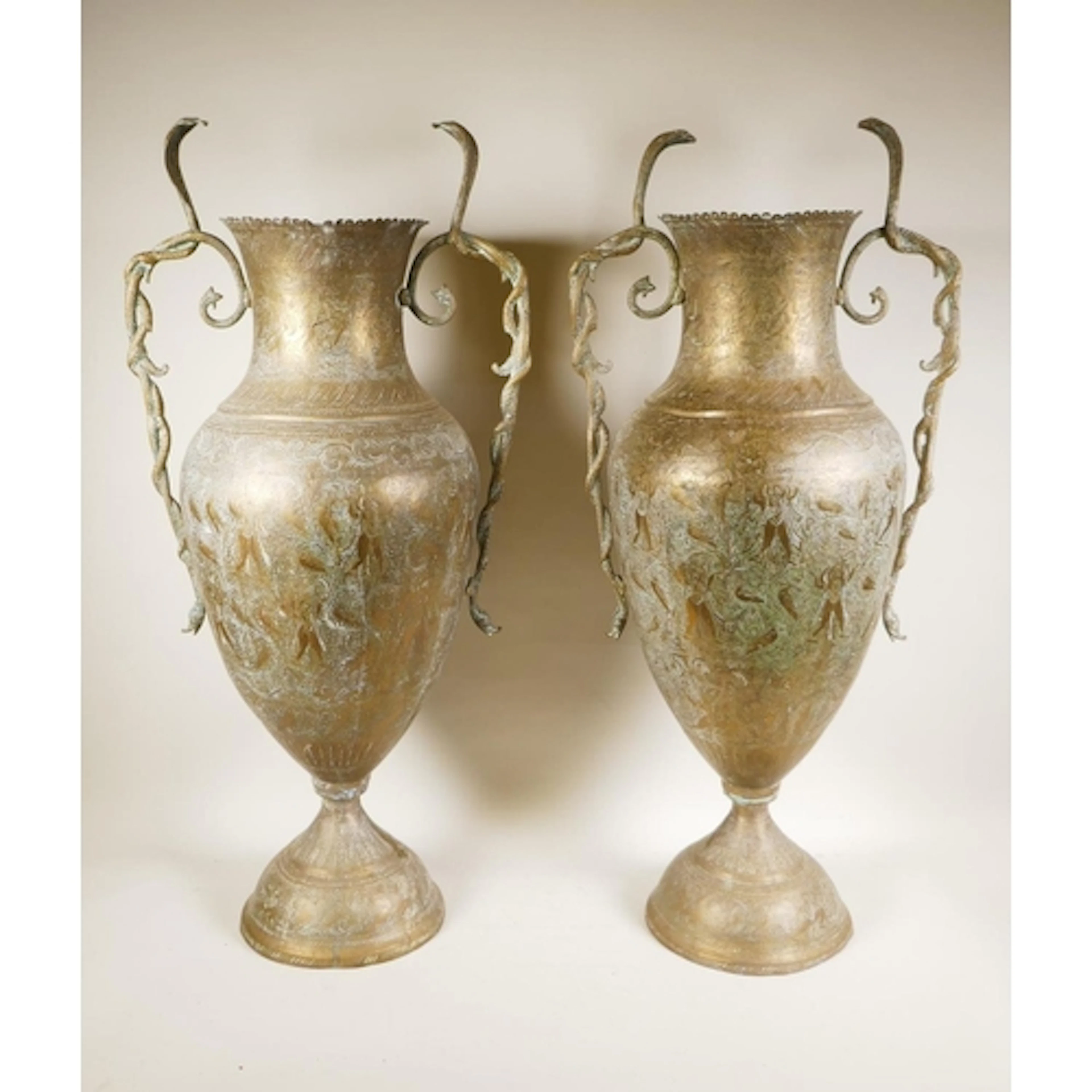 A pair of antique Benares brass floor vases with cobra handl...