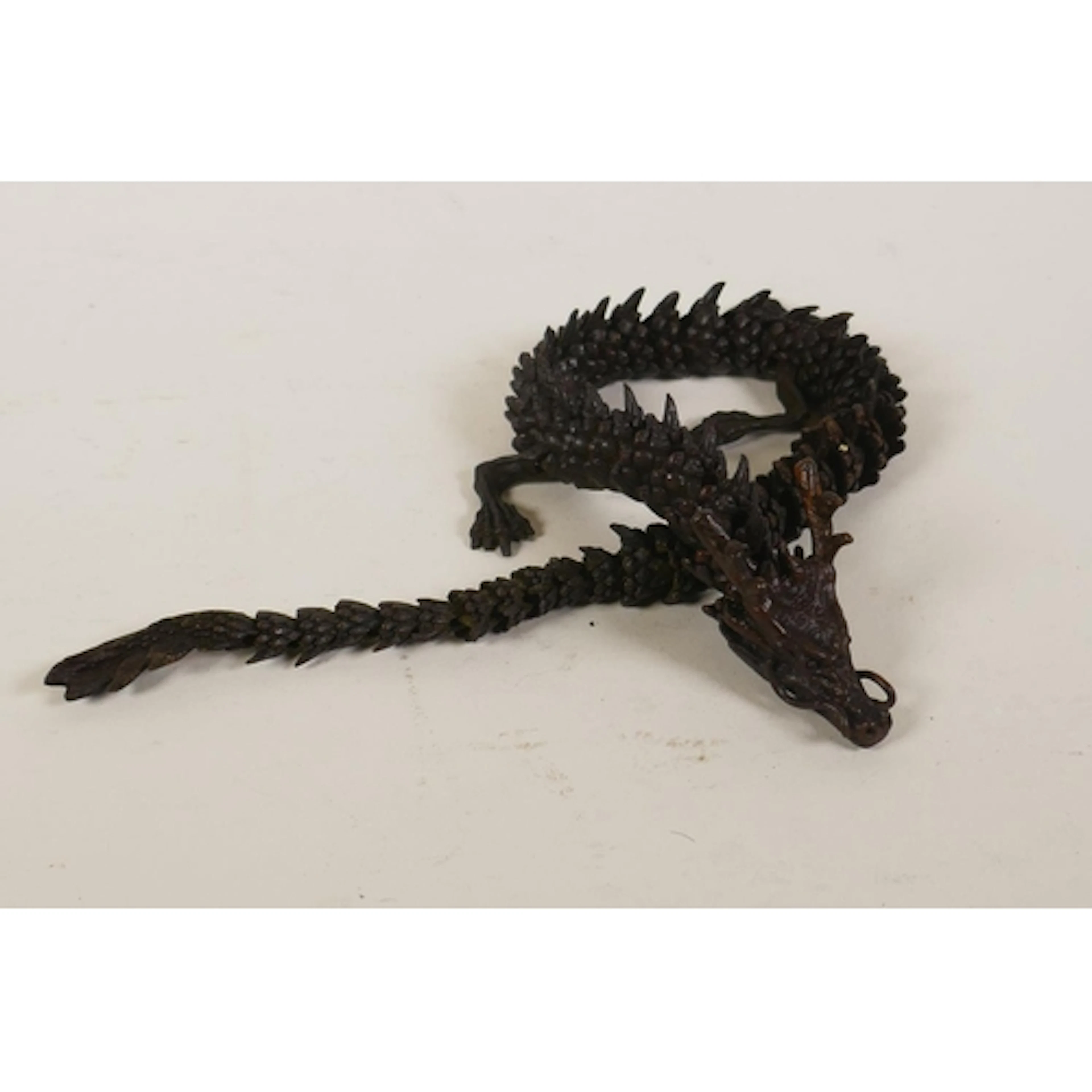 A Japanese jizai style articulated bronze dragon okimono, 41...