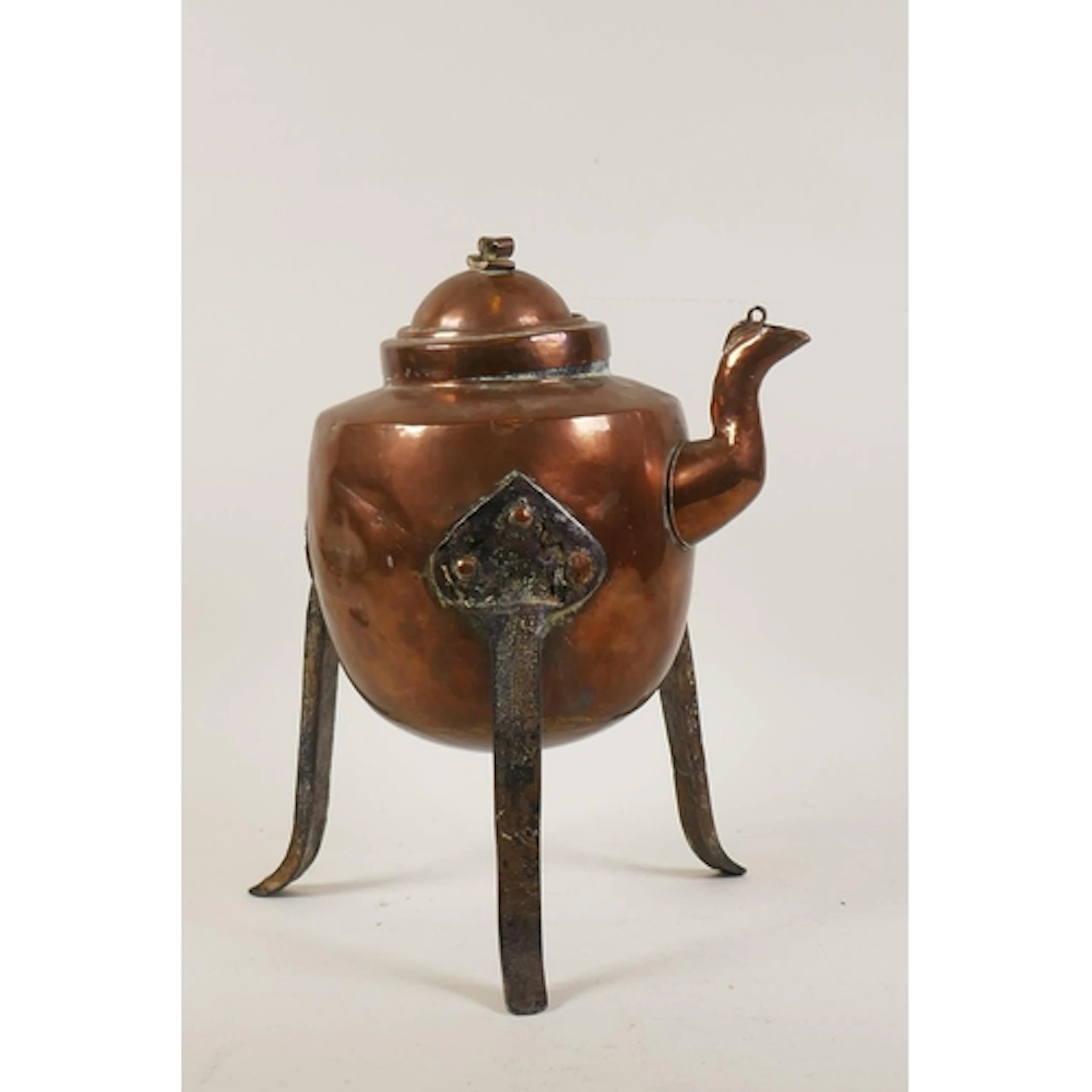 Antique Swedish copper kettle on wrought iron tripod support...
