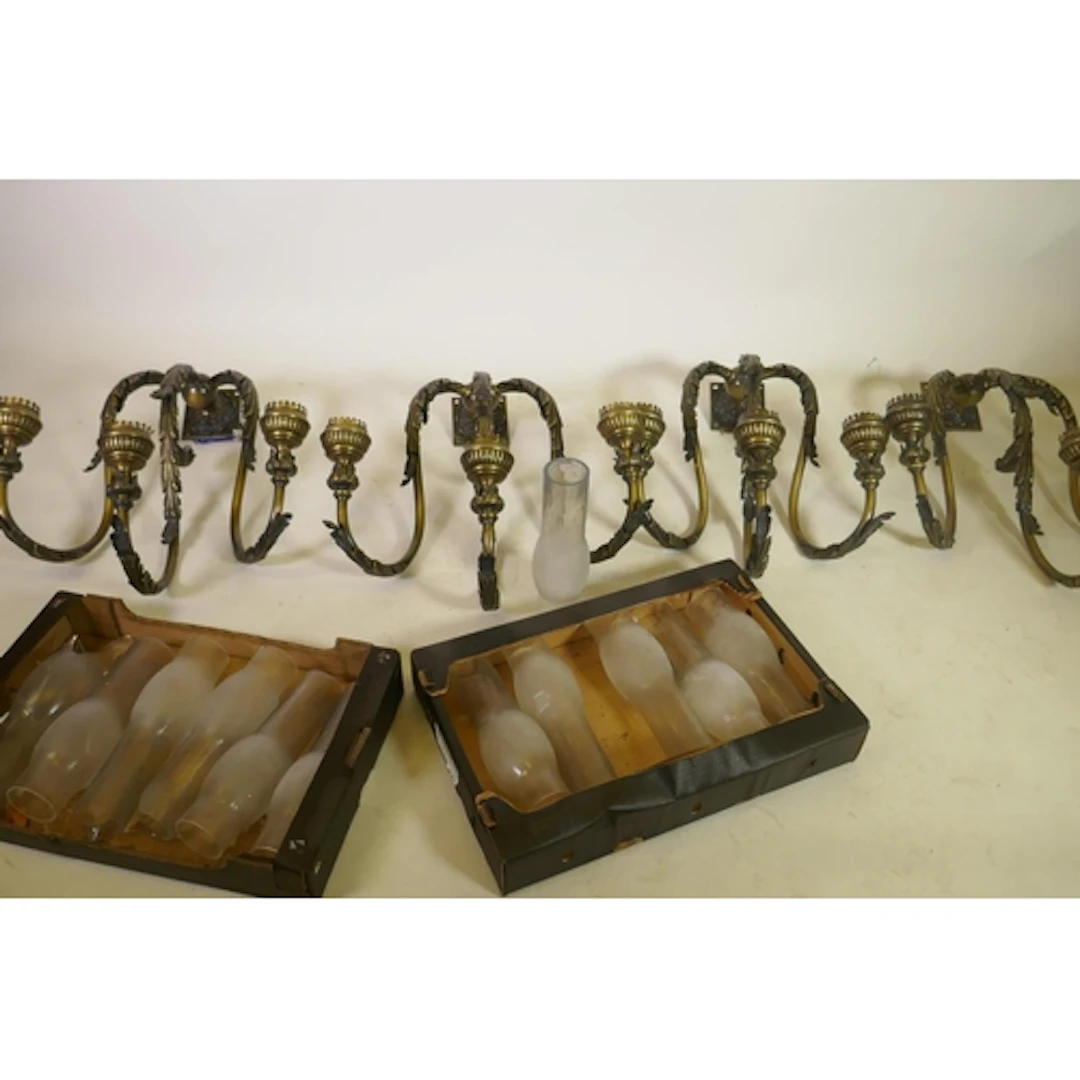 Set of four large patinated brass three branch wall lamps, 6...