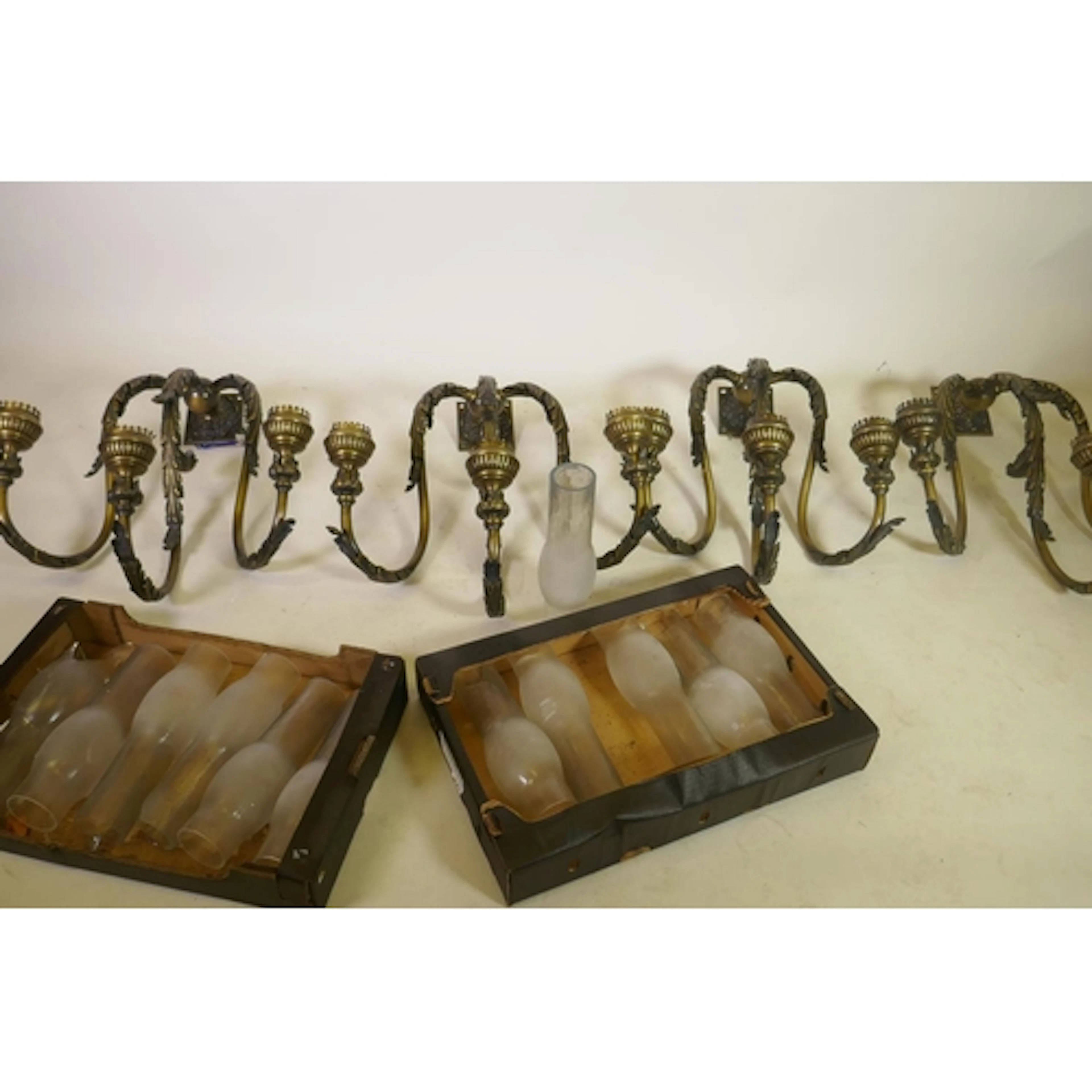 Set of four large patinated brass three branch wall lamps, 6...