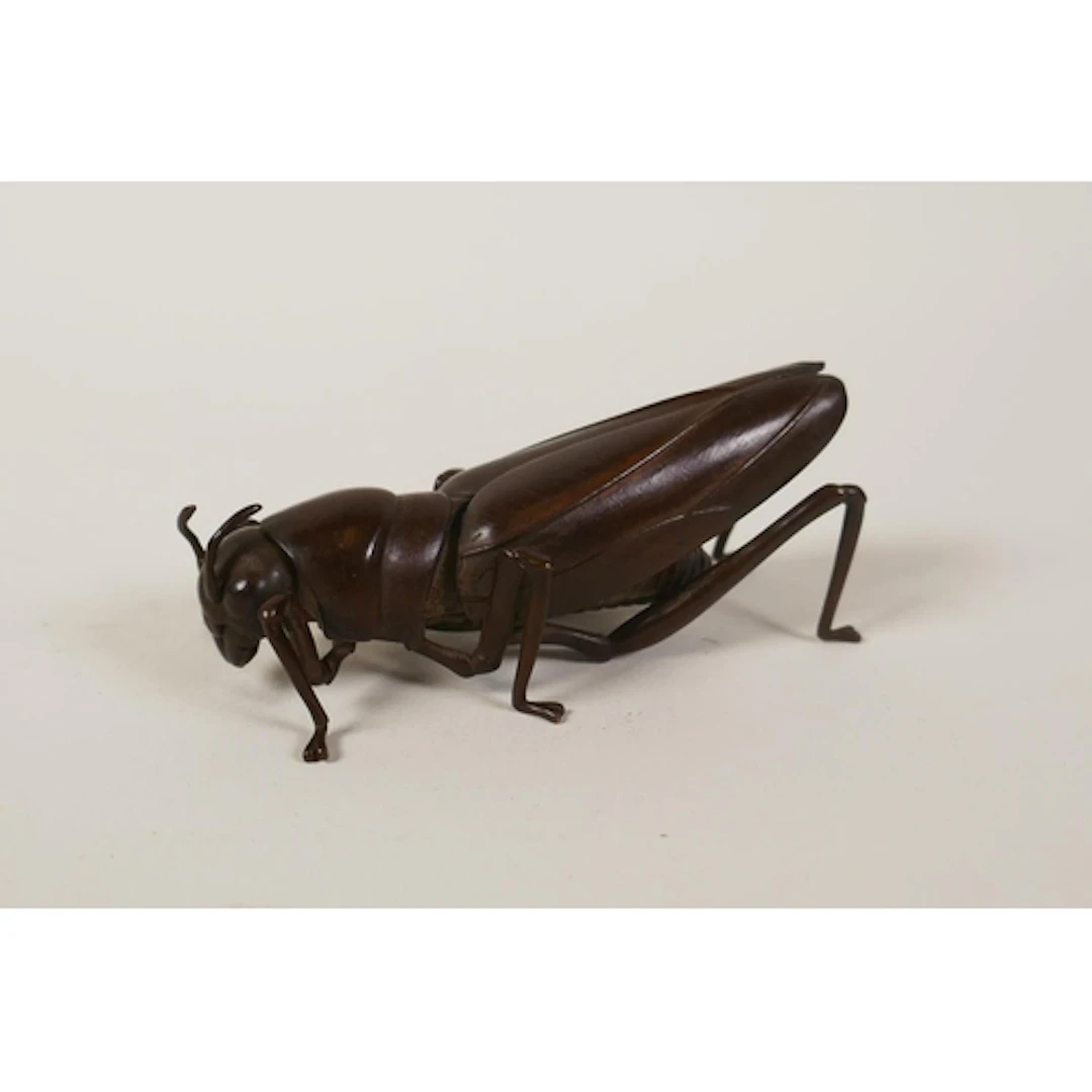 A Japanese jizai style bronze grasshopper with articulated l...