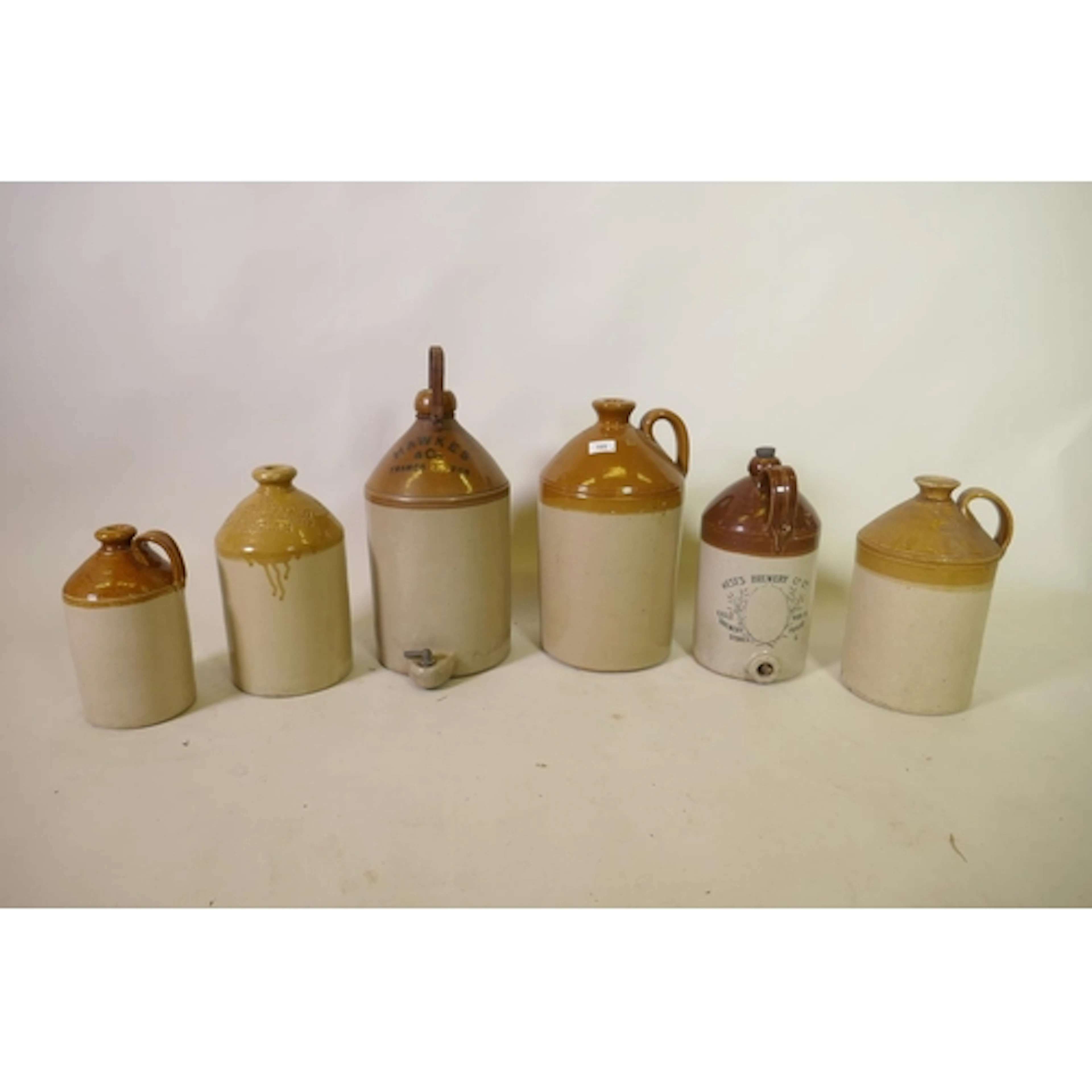 Six late C19th/early C20th two tone stoneware flagons of var...