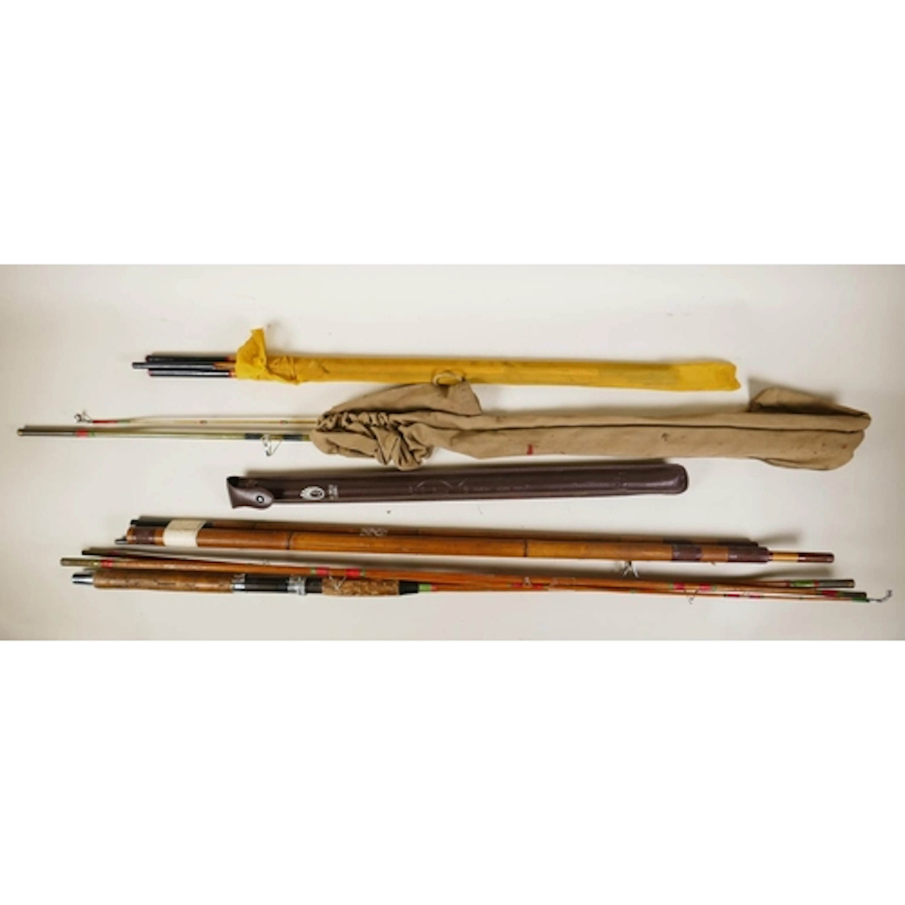A collection of five vintage fly fishing rods