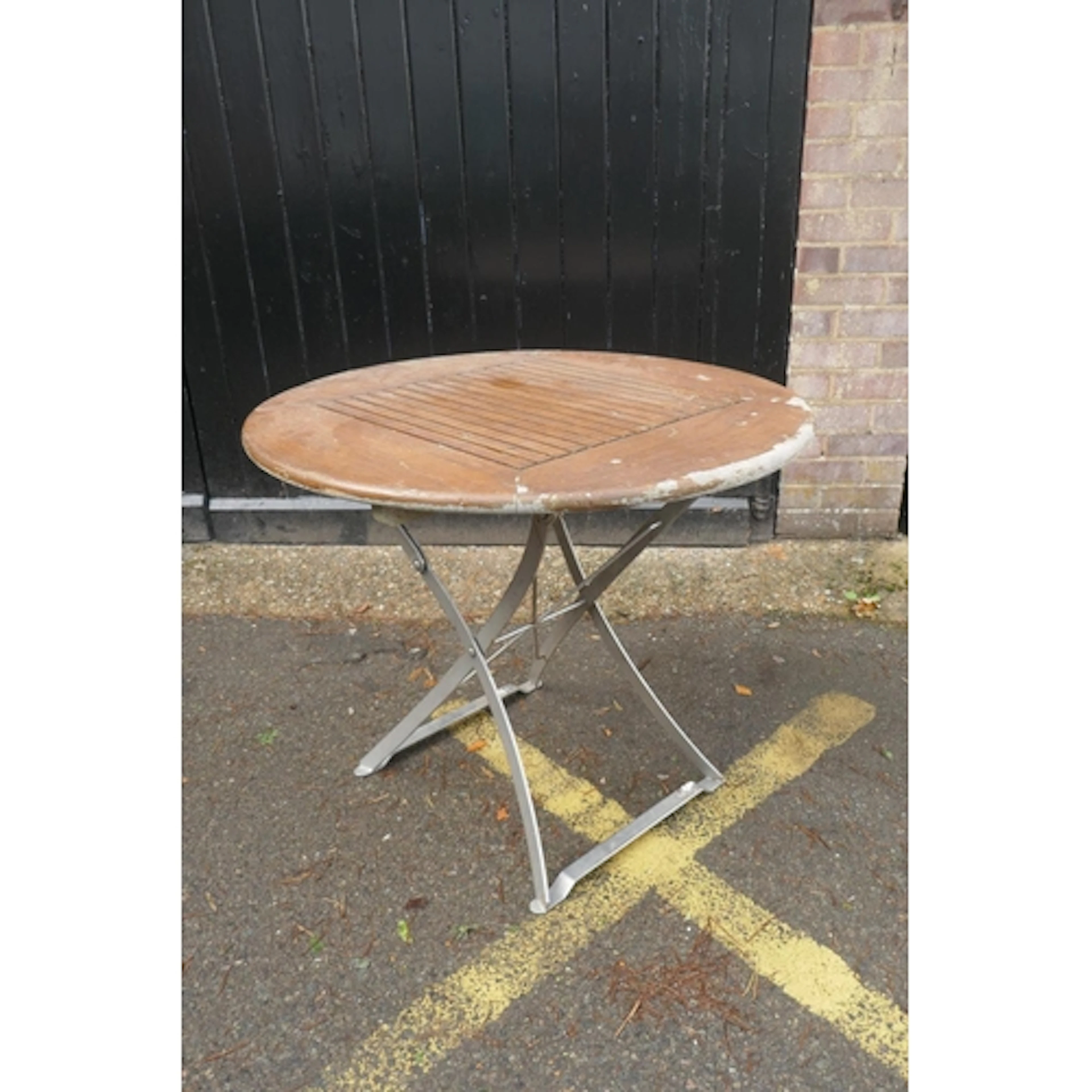 A single 'Lister' garden table with slatted teak top and met...