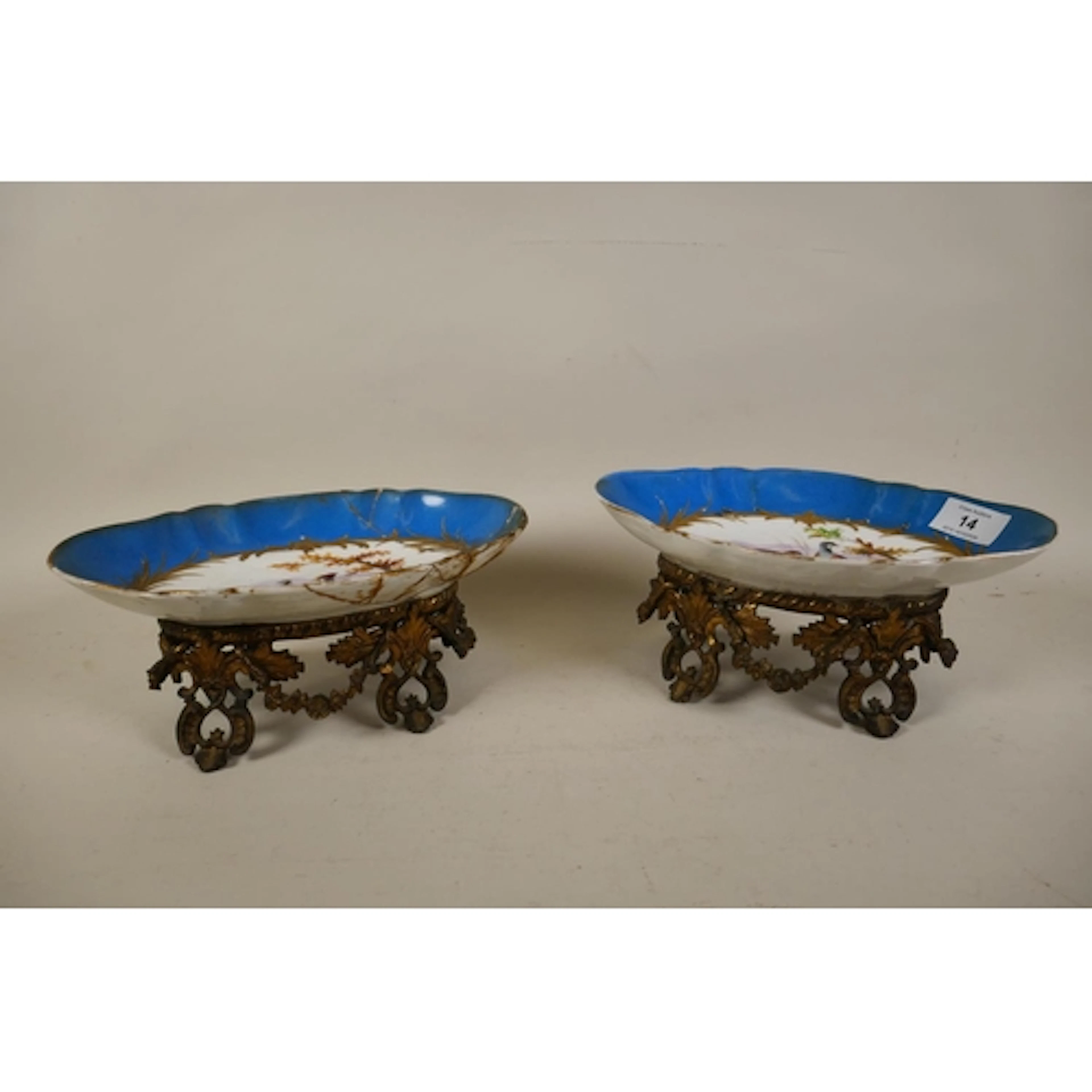 Pair of C19th Sevres style centrepieces, the shaped bowls wi...