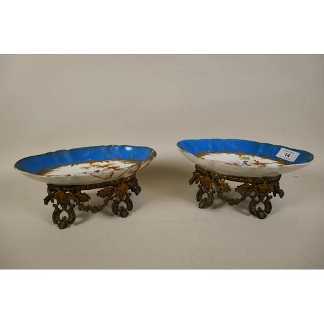 Pair of C19th Sevres style centrepieces, the shaped bowls wi...